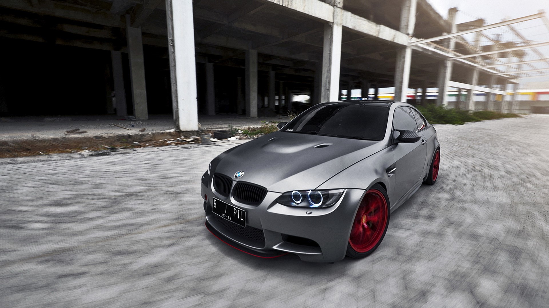 Silver BMW M3 with red rims in abandoned building HD Wallpaper