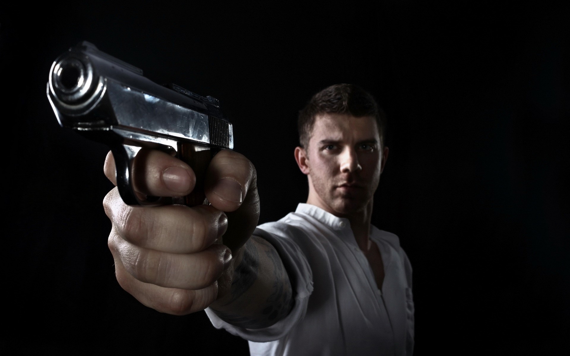 Man holding a pistol HD Wallpaper