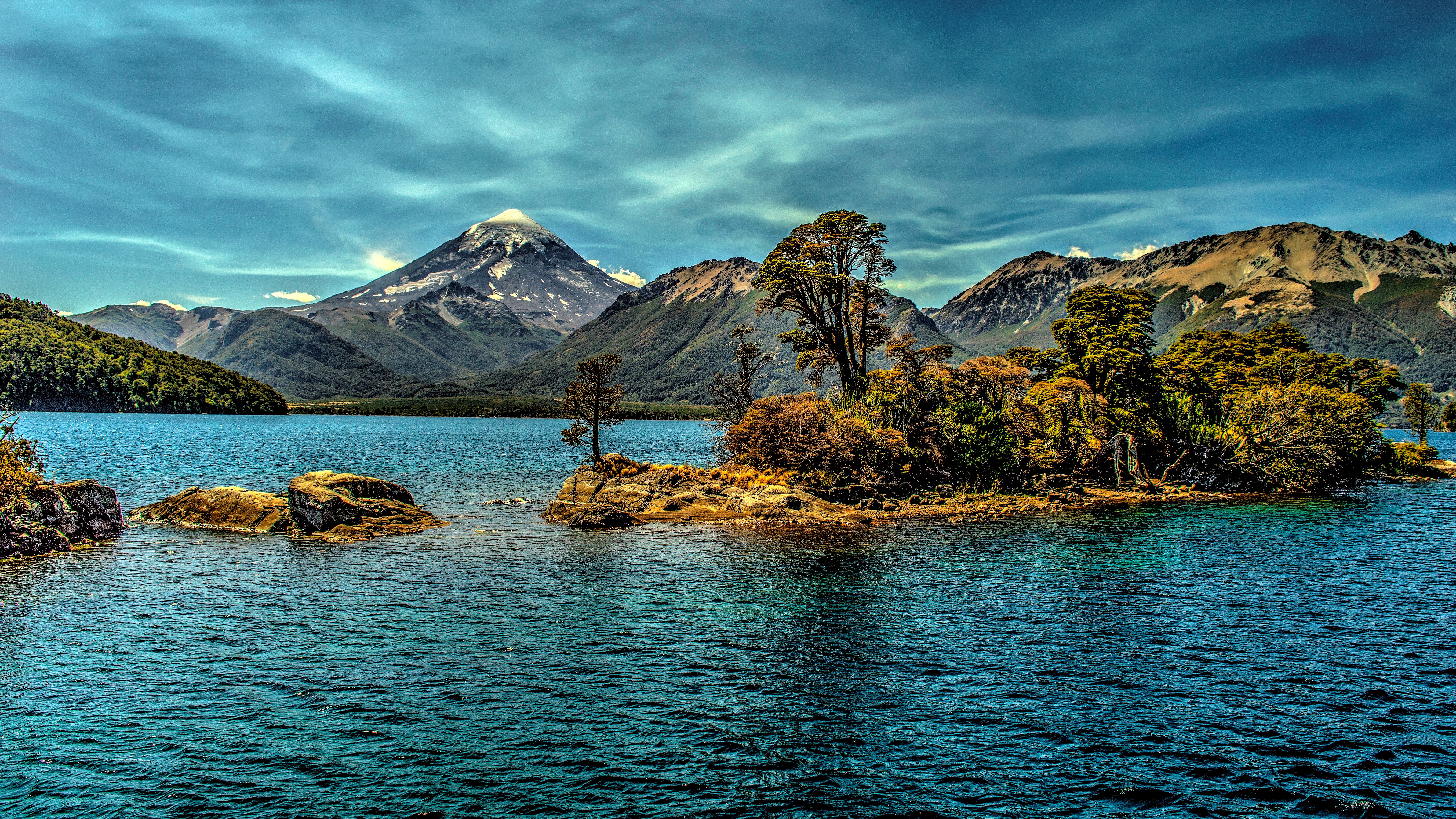 Island in a lake with mountains and a volcano HD Wallpaper