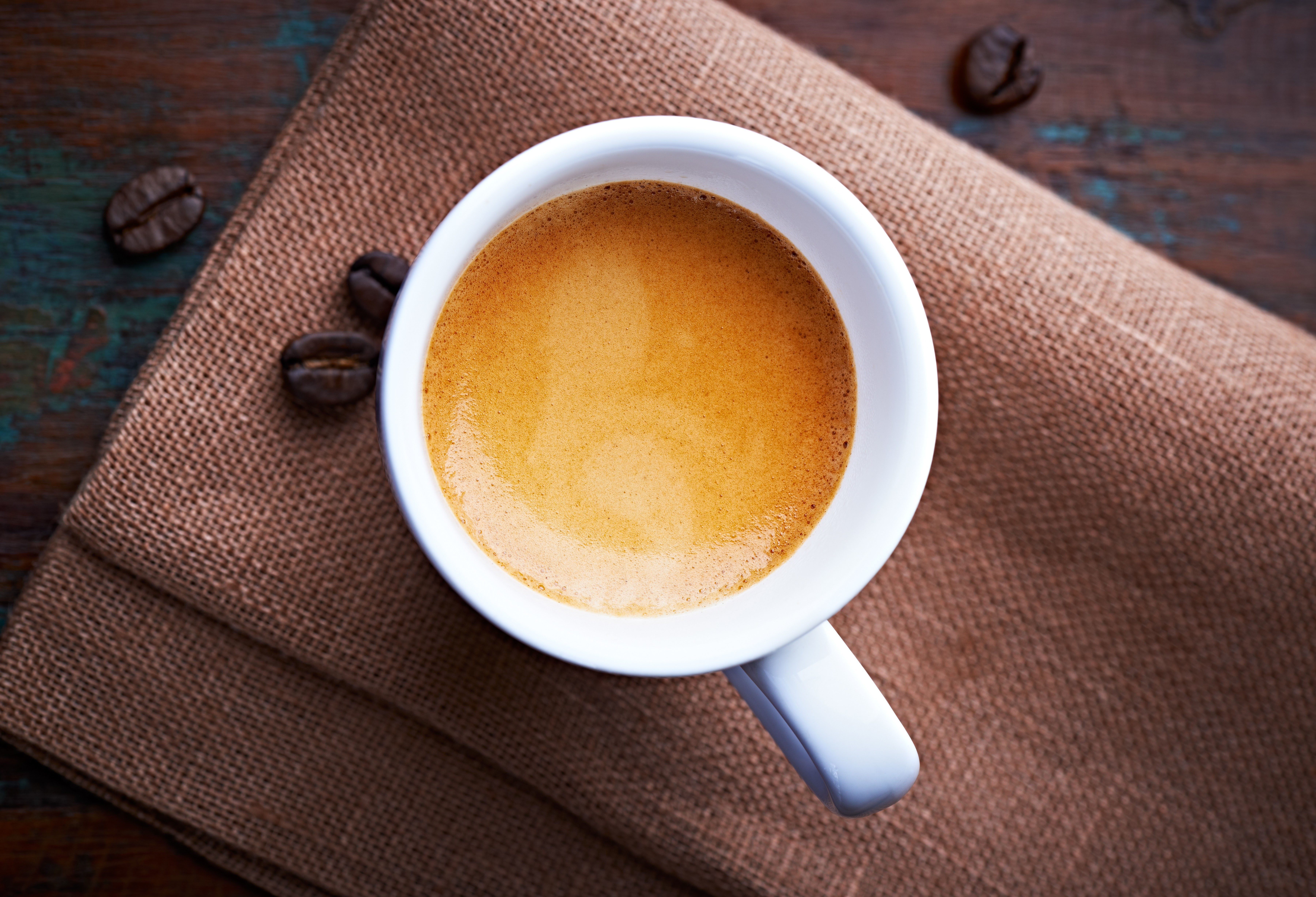 Espresso cup with coffee beans HD Wallpaper