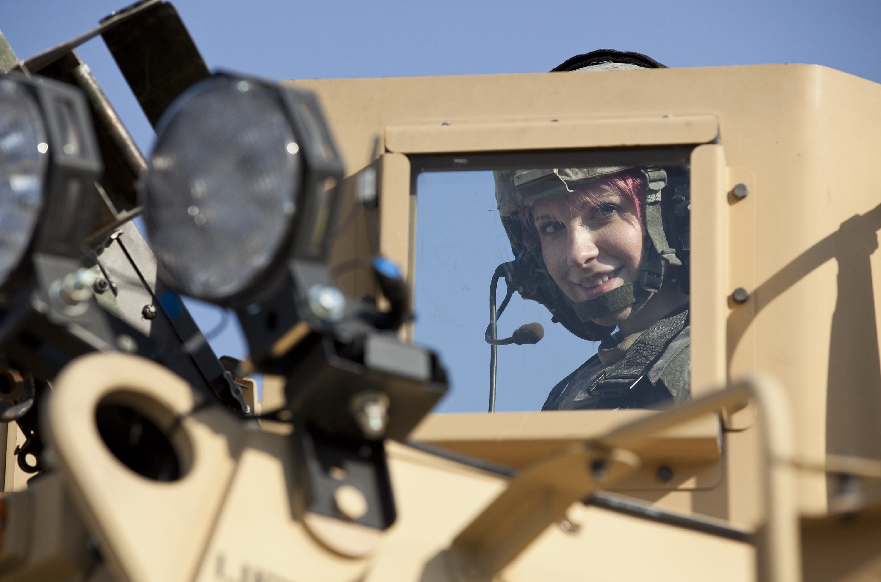 Soldier with pink hair in a military vehicle HD Wallpaper