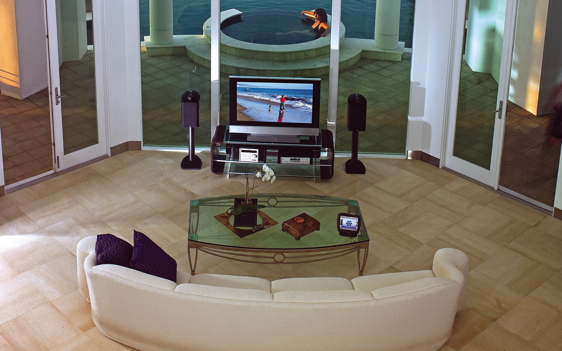 Living room with sofa, TV, and outdoor pool HD Wallpaper