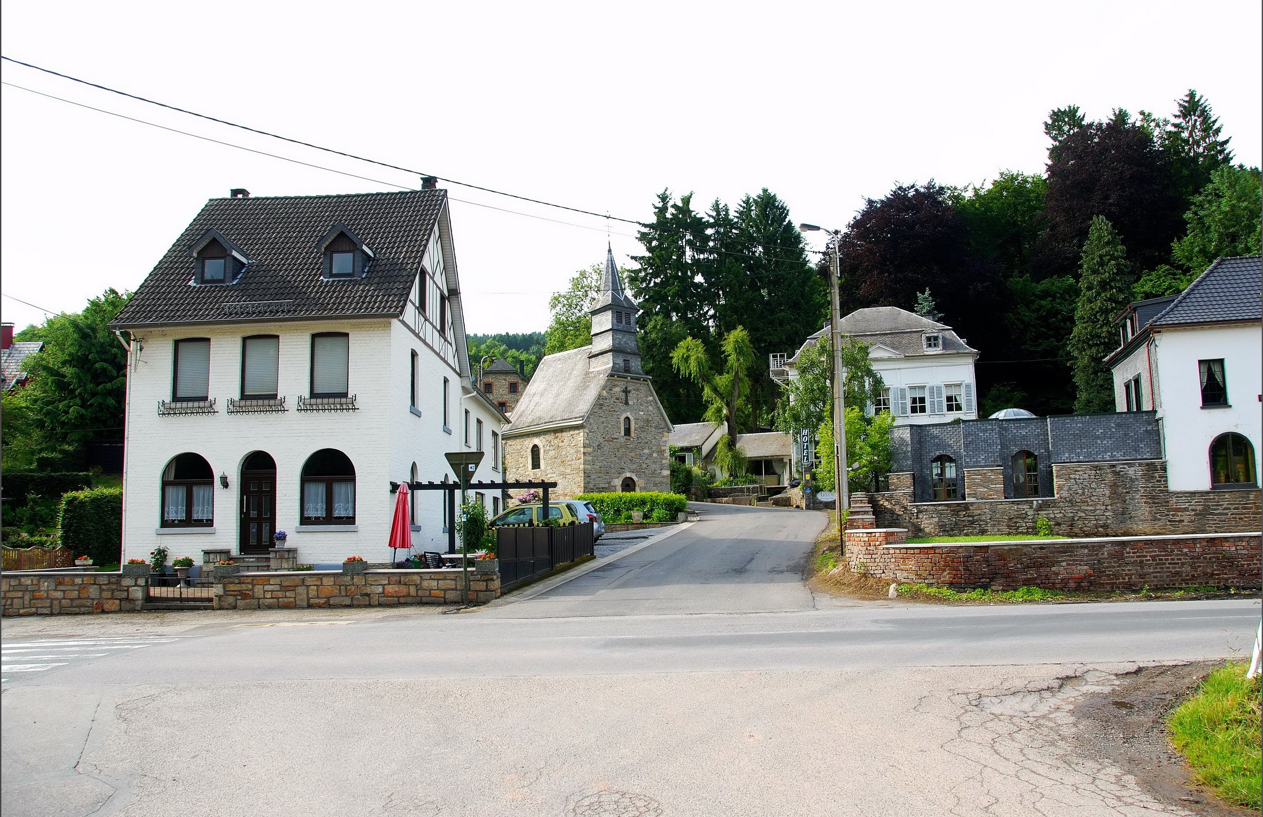 Houses and a church in a Belgian village HD Wallpaper