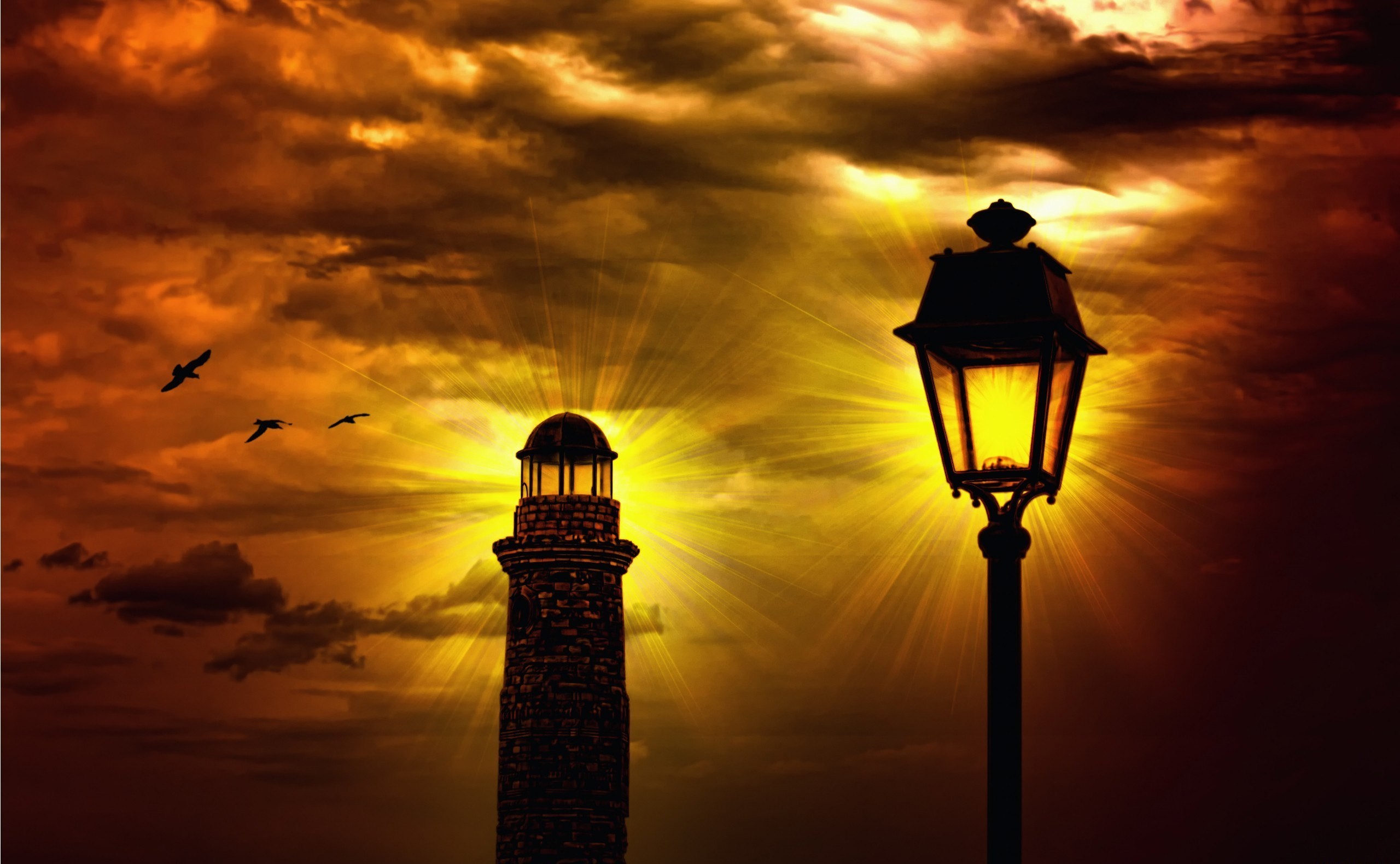 Lighthouse and street lamp against a dramatic sunset sky with birds HD Wallpaper
