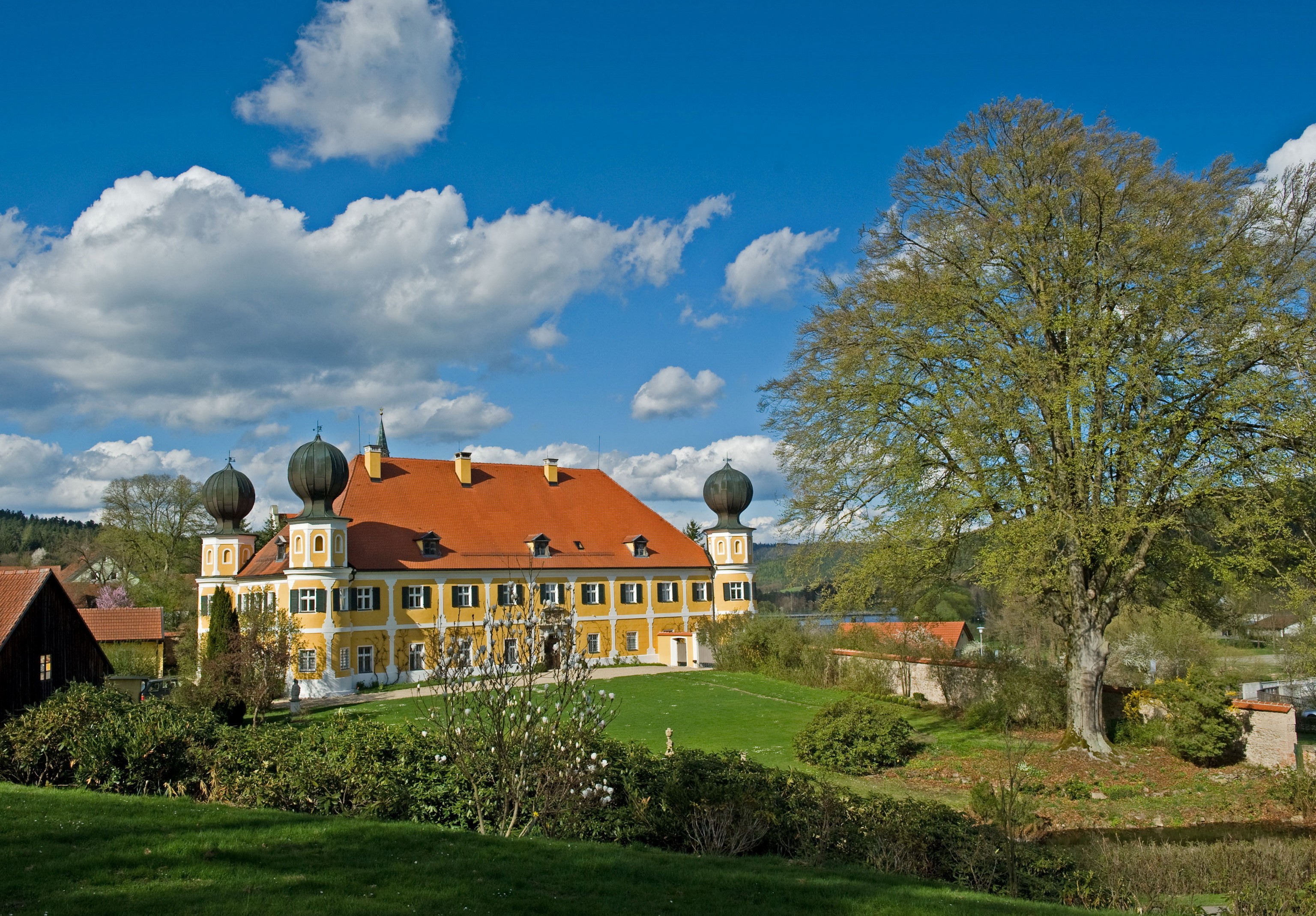 Schloss Ramspau castle in Germany with trees and clouds HD Wallpaper