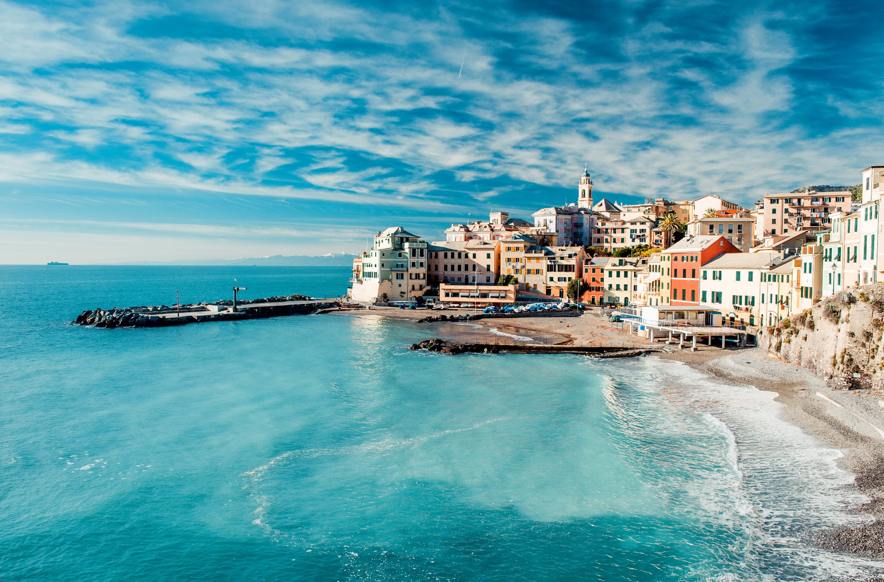 Colorful Italian coastal town with a beach and blue sea HD Wallpaper
