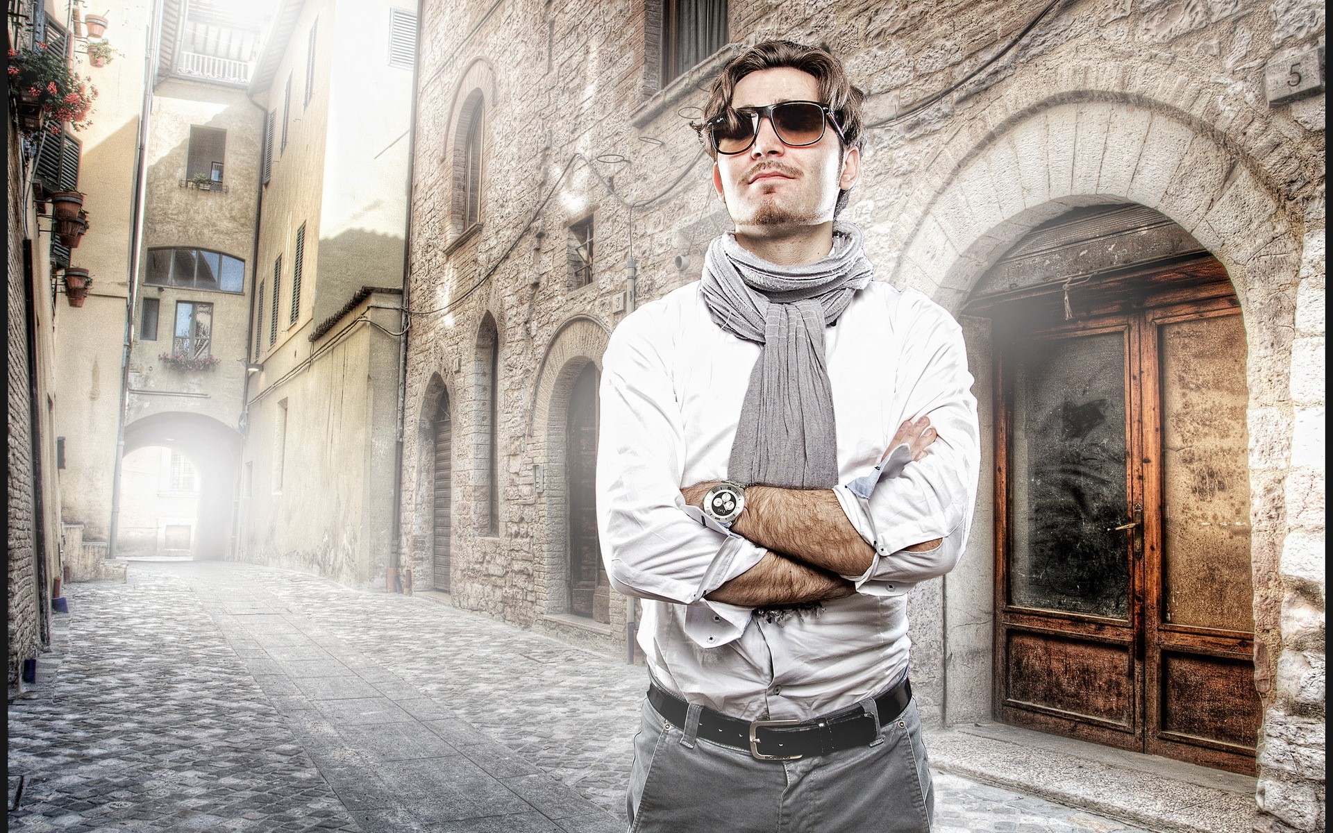 Man in sunglasses and scarf in Italian alley HD Wallpaper