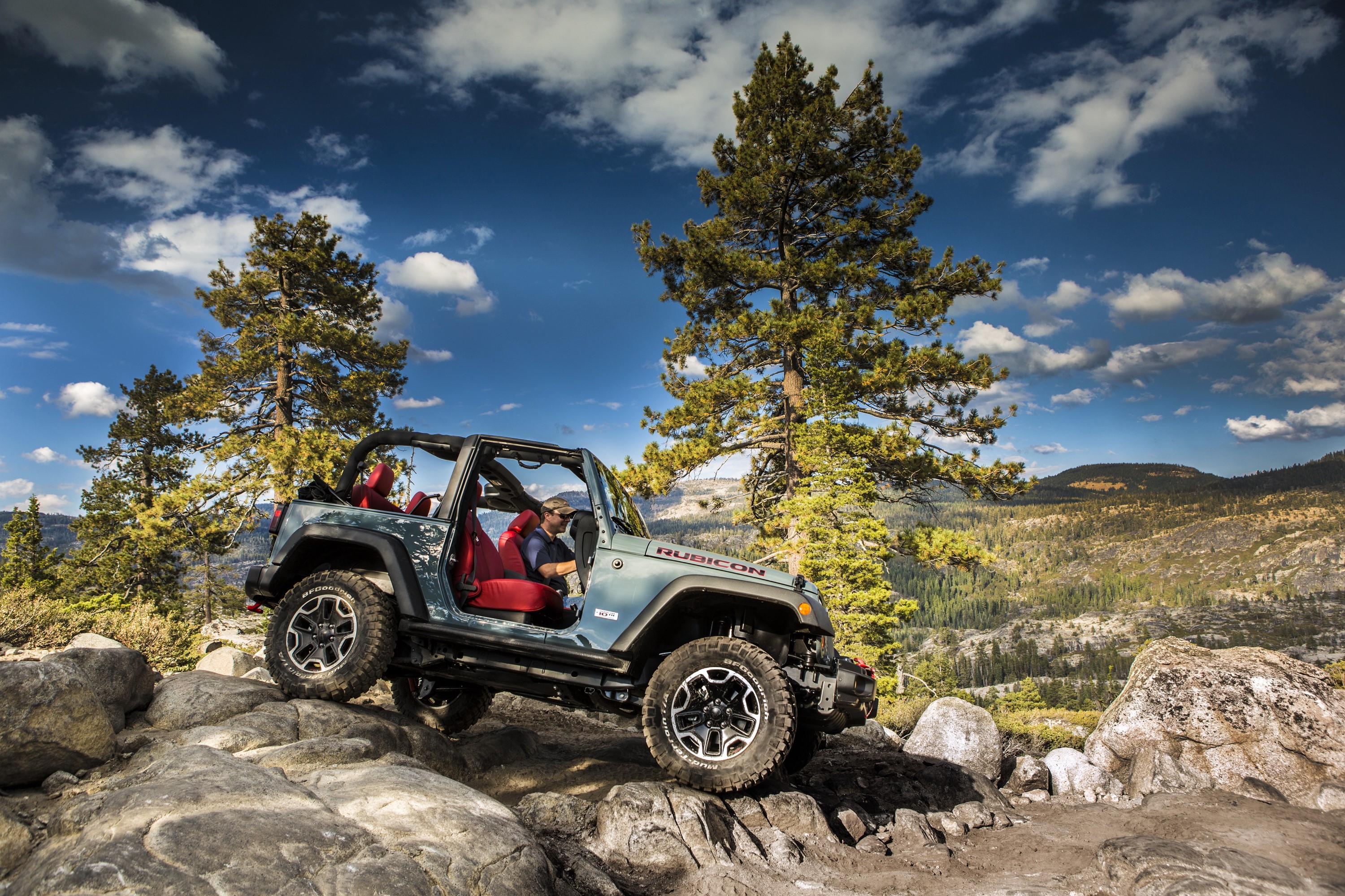 Jeep Wrangler Rubicon off-roading on rocky terrain HD Wallpaper