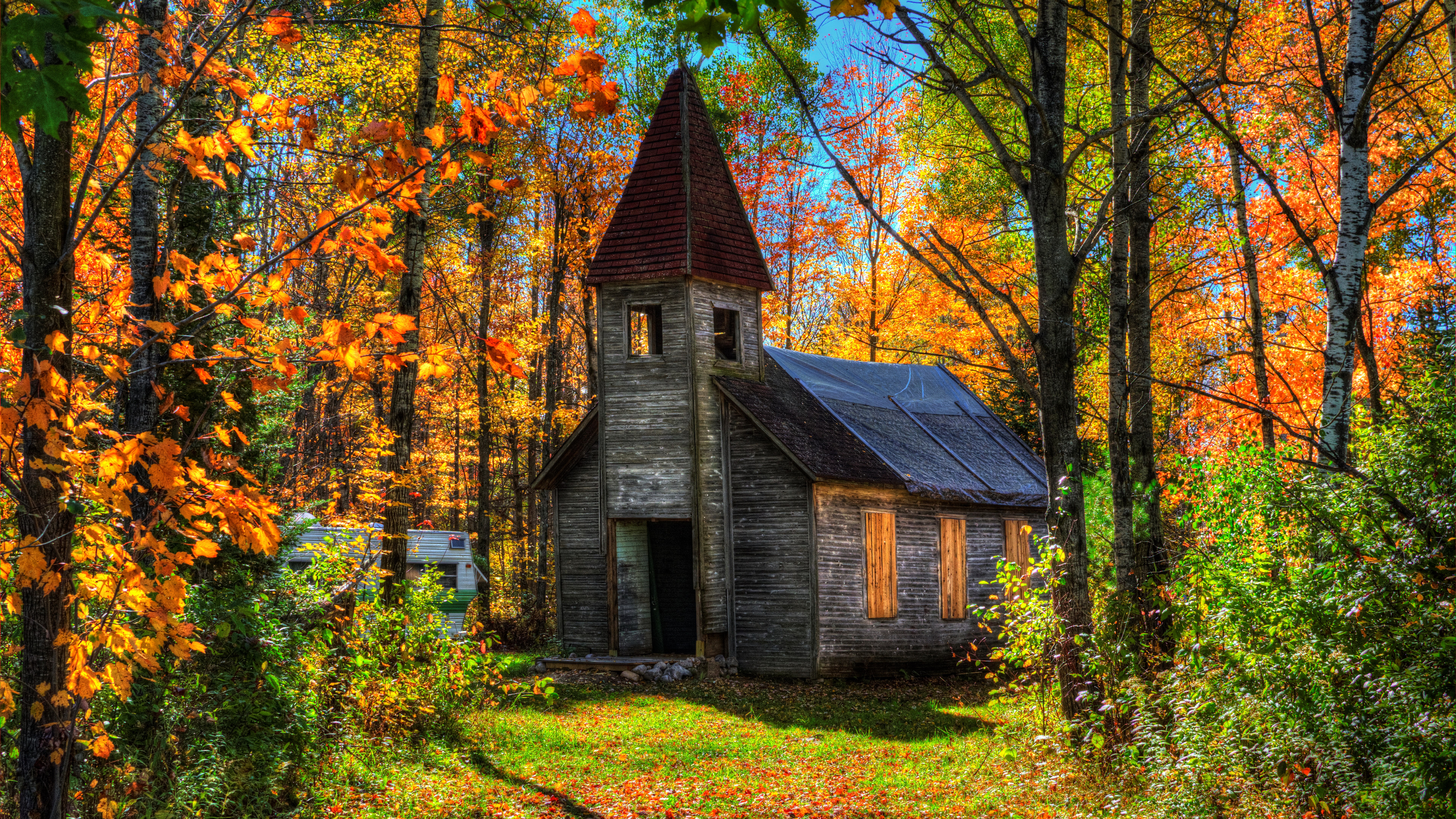 Abandoned church in autumn forest HD Wallpaper