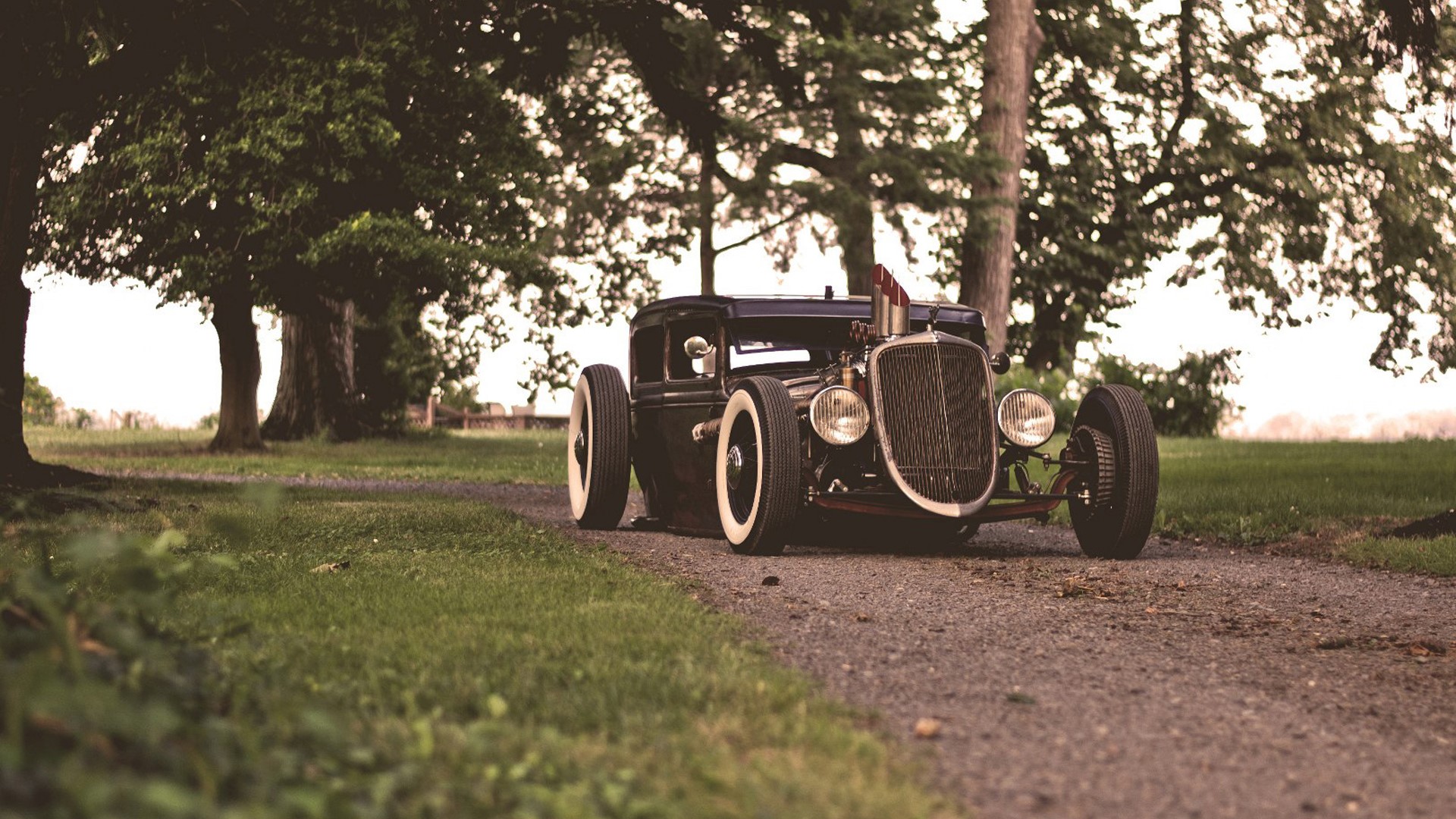 Ratrod car on a gravel road with trees HD Wallpaper