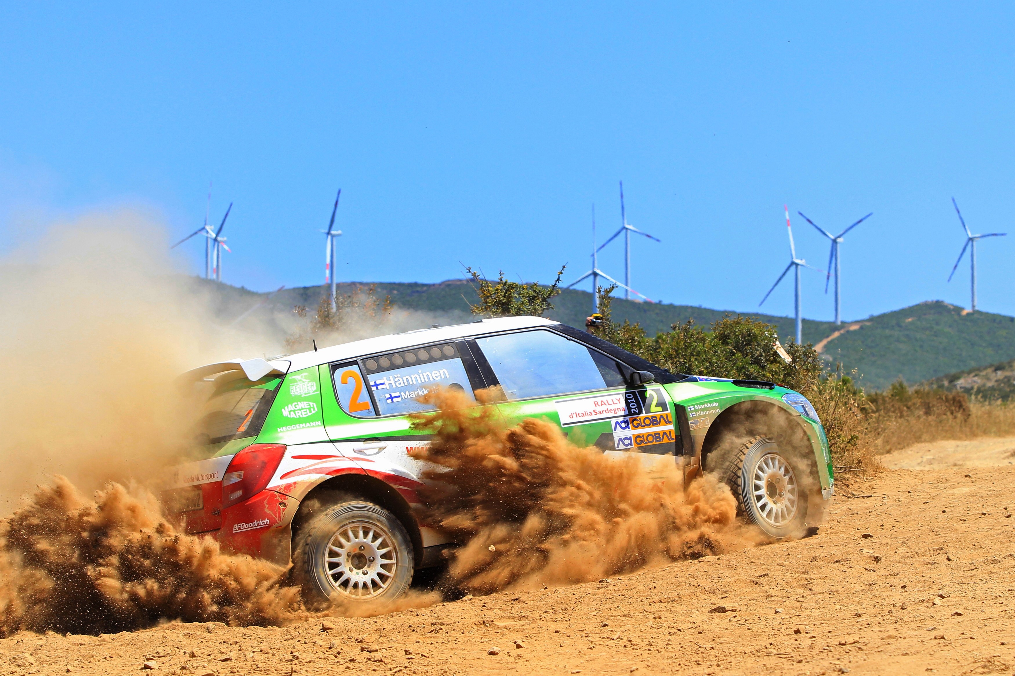 Skoda Fabia rally car kicking up sand HD Wallpaper