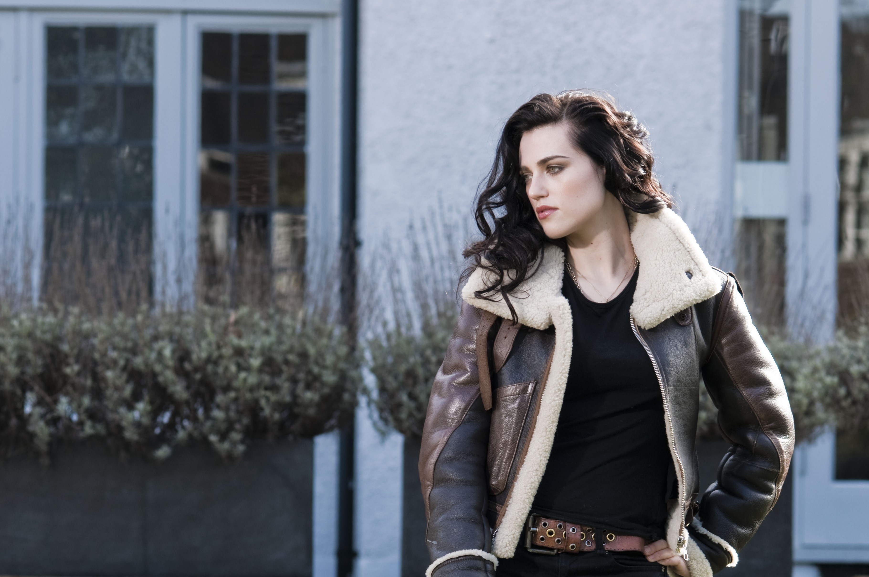 Katie McGrath wearing a brown leather jacket HD Wallpaper