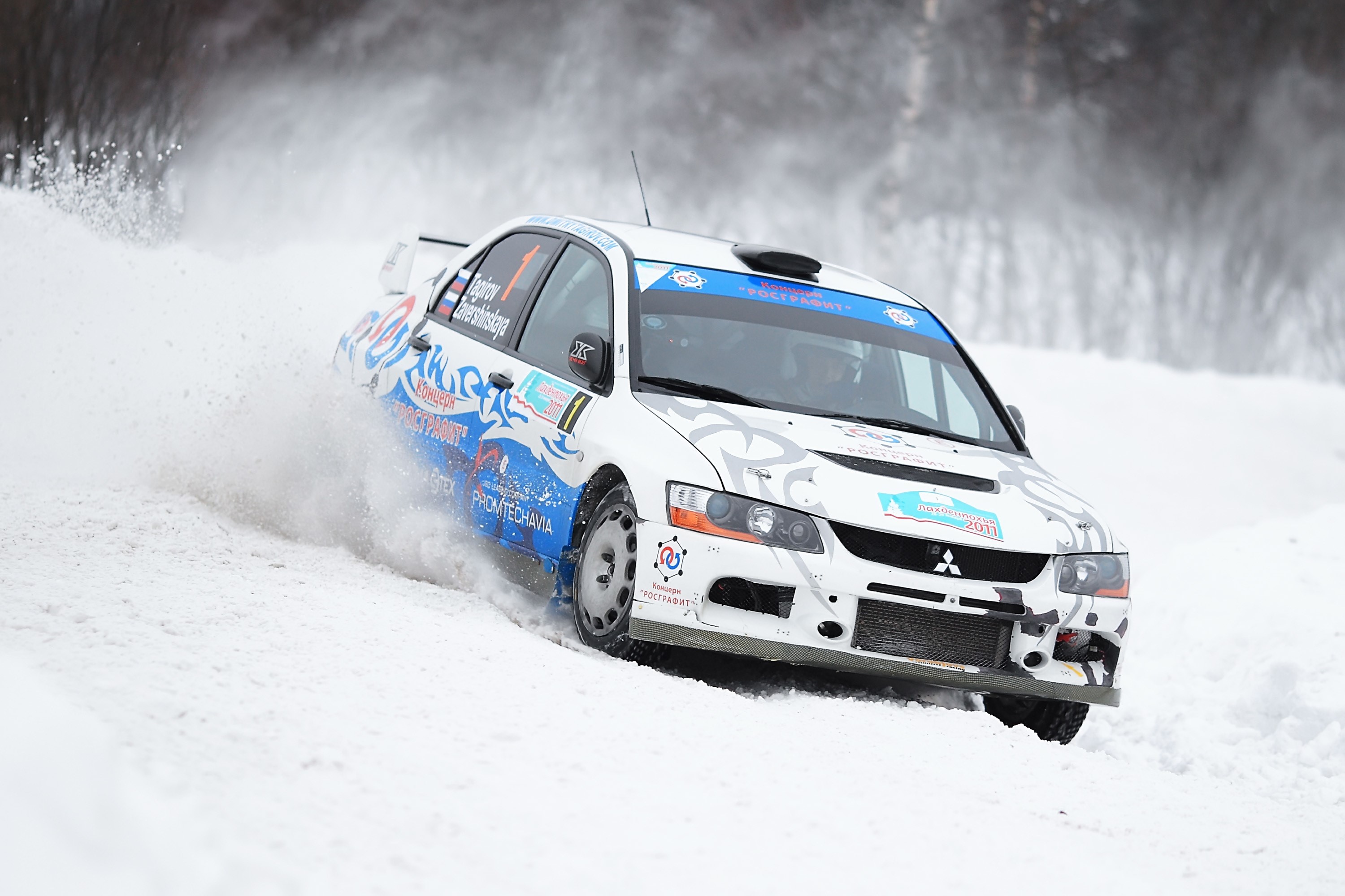 Mitsubishi Lancer Evolution rally car racing on snow HD Wallpaper