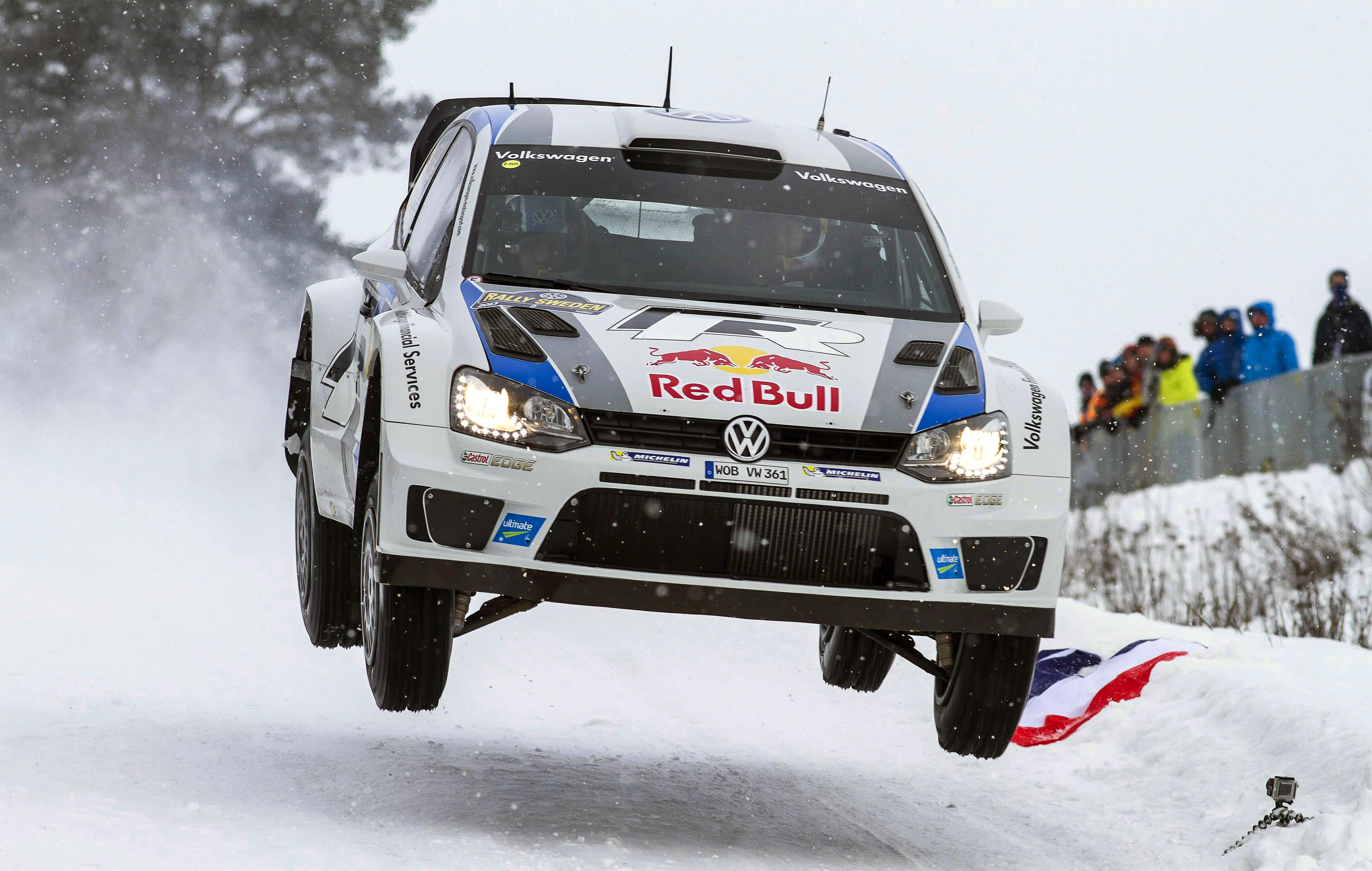 Volkswagen Polo rally car jumping in snow HD Wallpaper