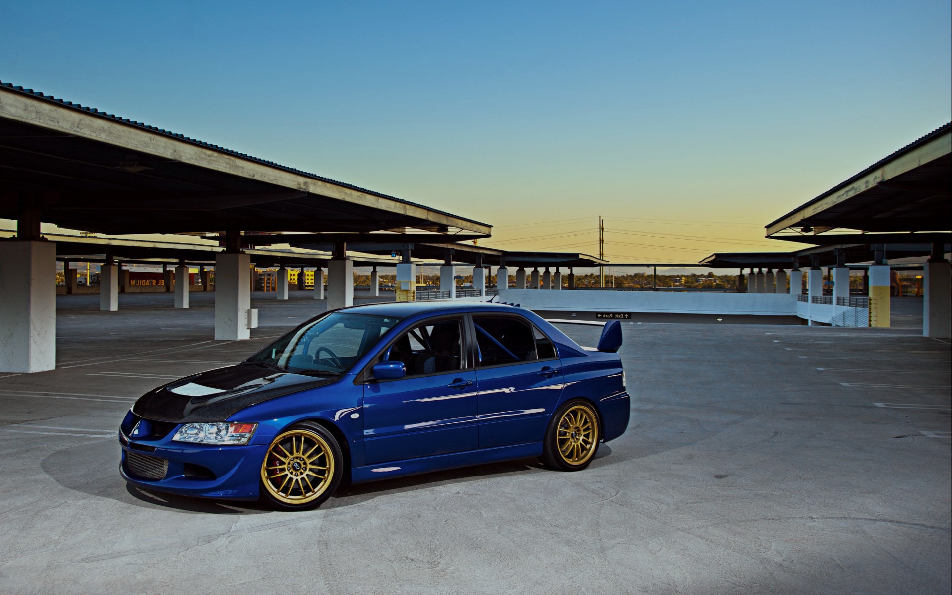 Blue Mitsubishi Lancer Evolution in Parking Lot HD Wallpaper