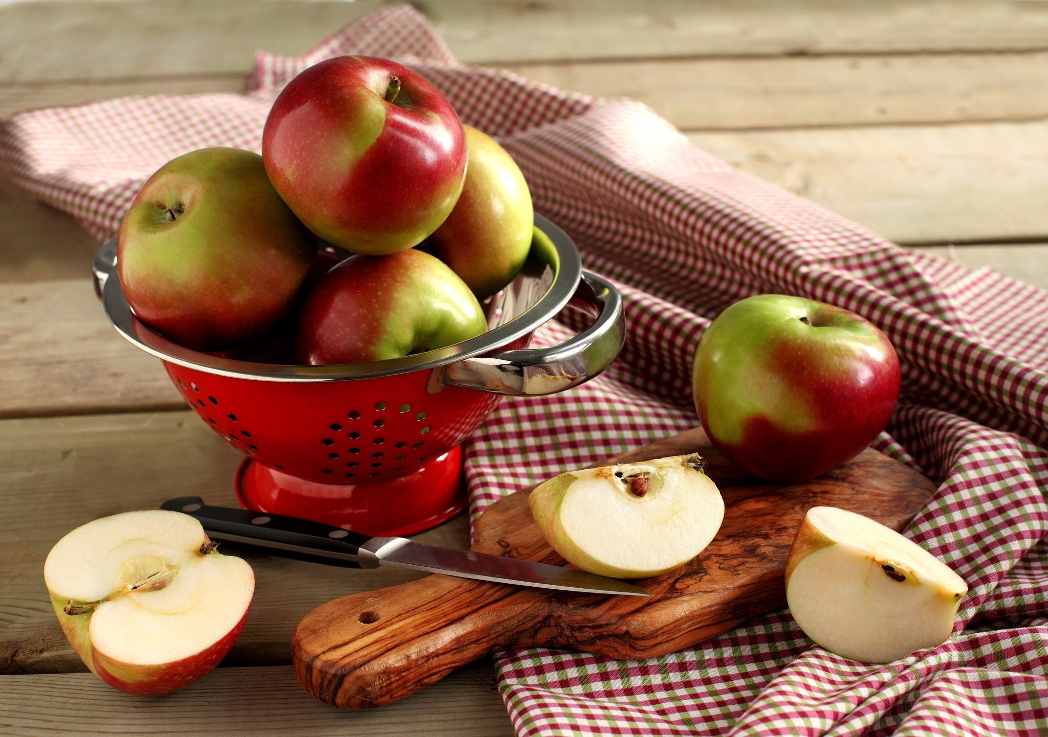Apples in a colander with a knife HD Wallpaper