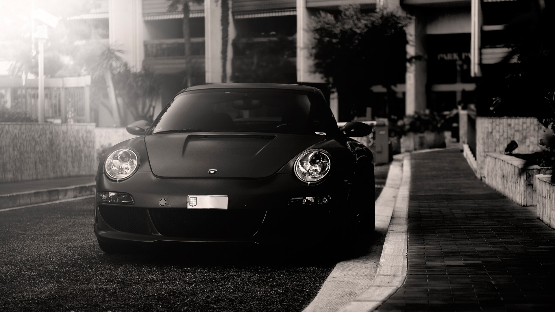 Black Porsche parked on a street HD Wallpaper
