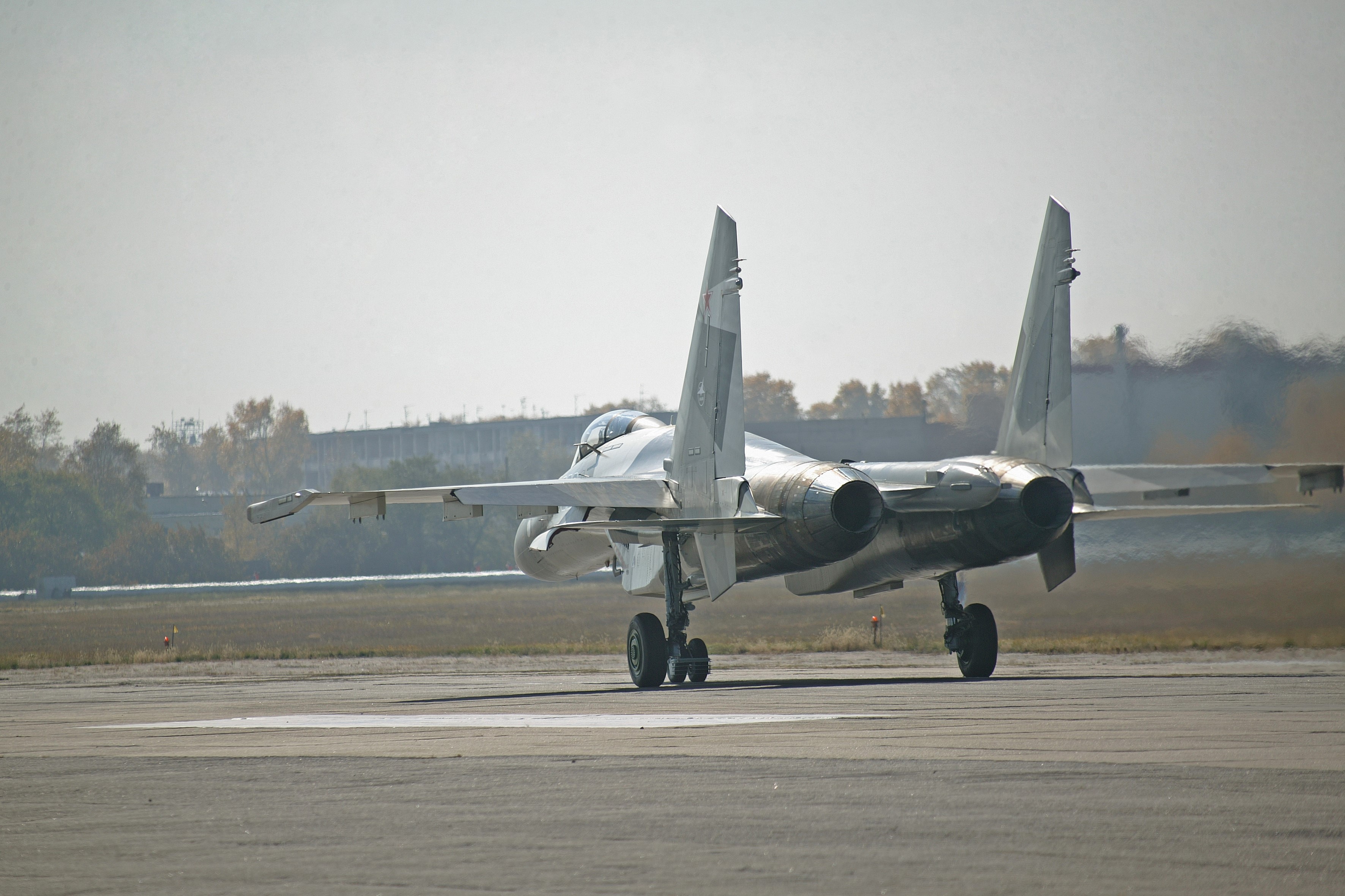 Sukhoi Su-35 fighter jet on runway HD Wallpaper