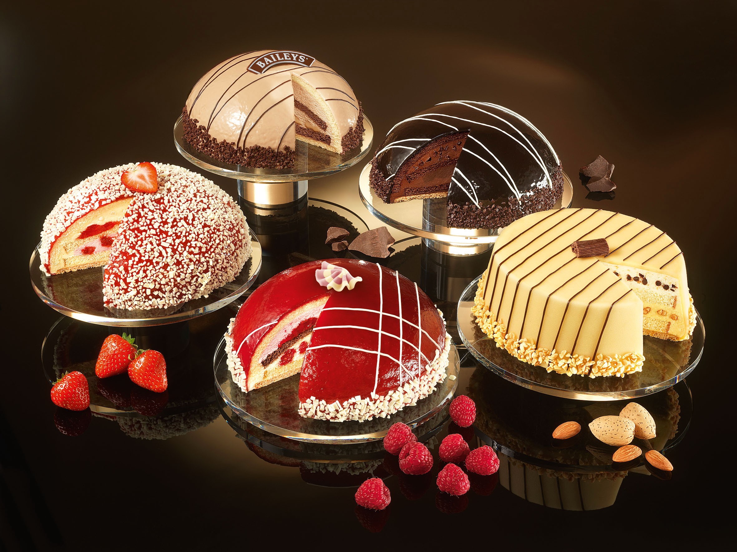 Assortment of Dome and Round Cakes with Fruit and Nuts HD Wallpaper