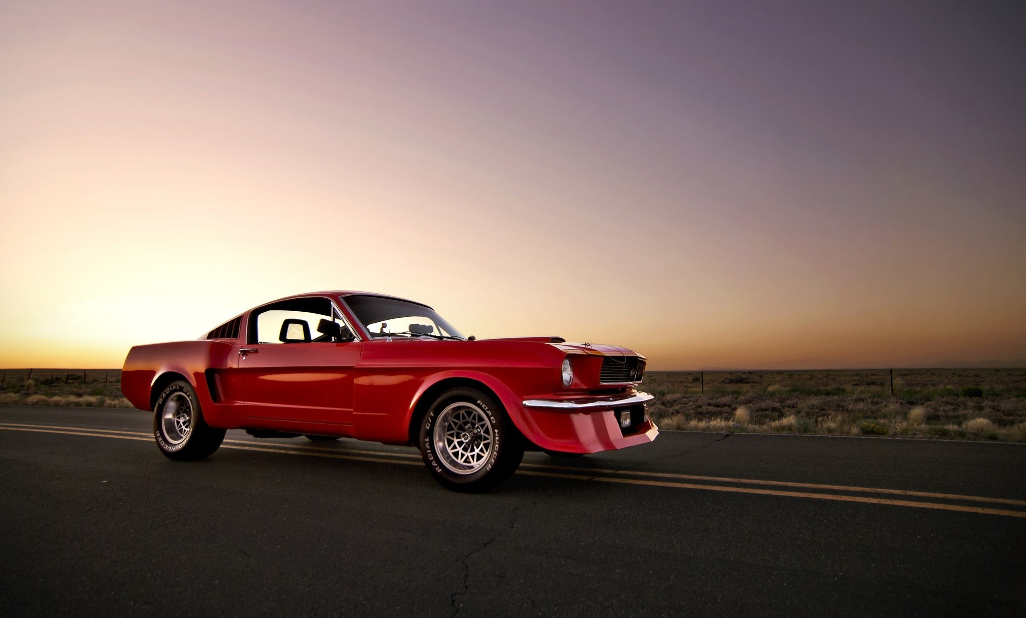 Red Ford Mustang on a road at sunset HD Wallpaper