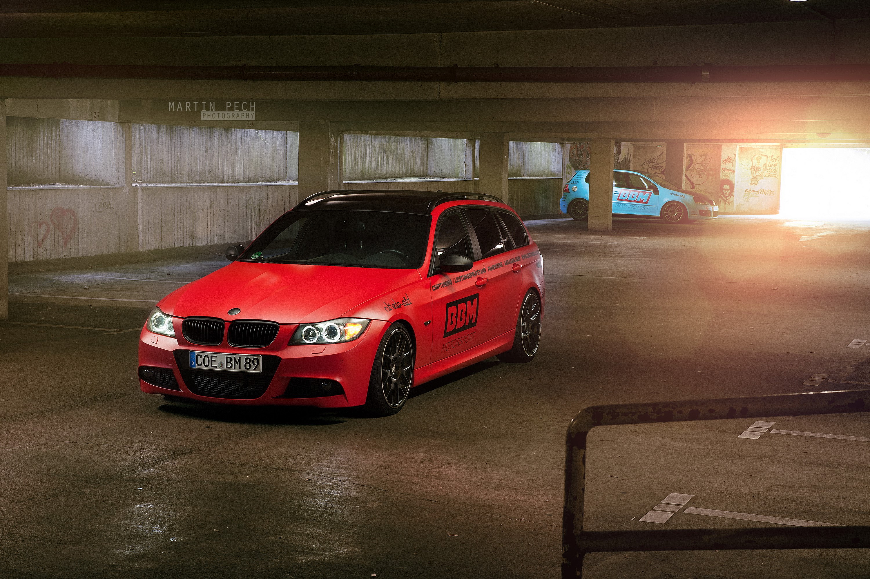 Red BMW 330d wagon in parking garage HD Wallpaper