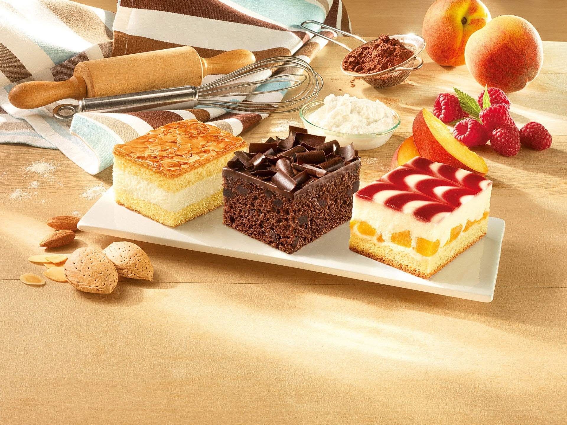 Three small cakes with baking ingredients HD Wallpaper