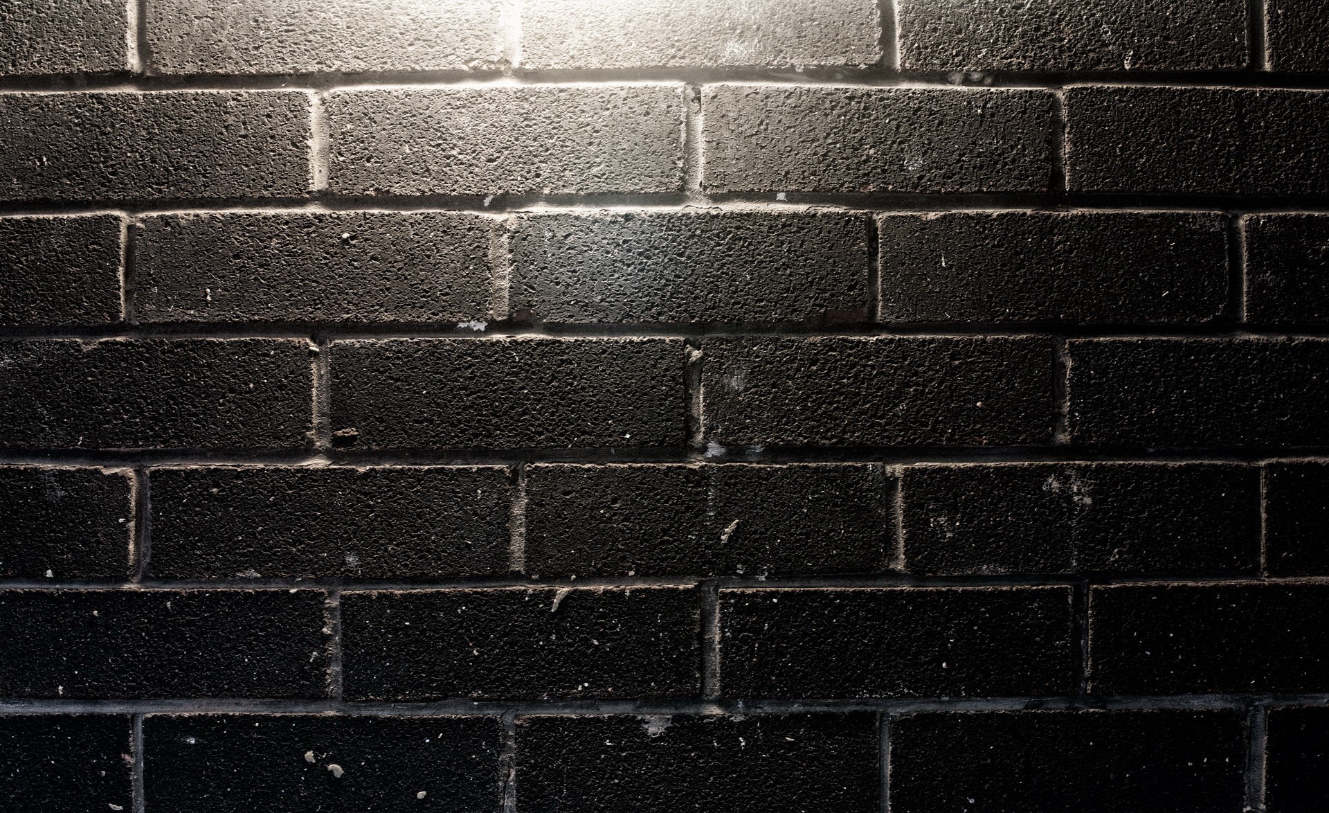 Black brick wall with light HD Wallpaper