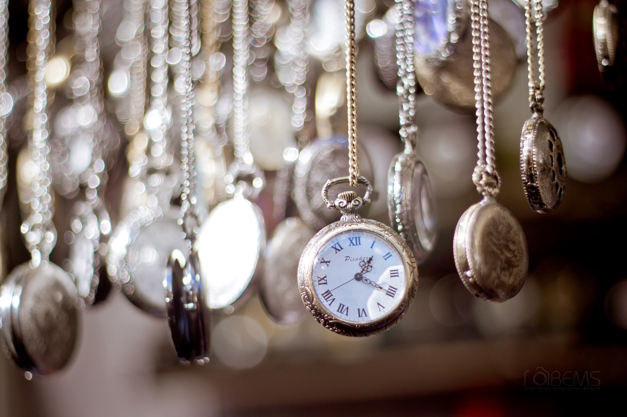Collection of antique pocket watches on chains HD Wallpaper