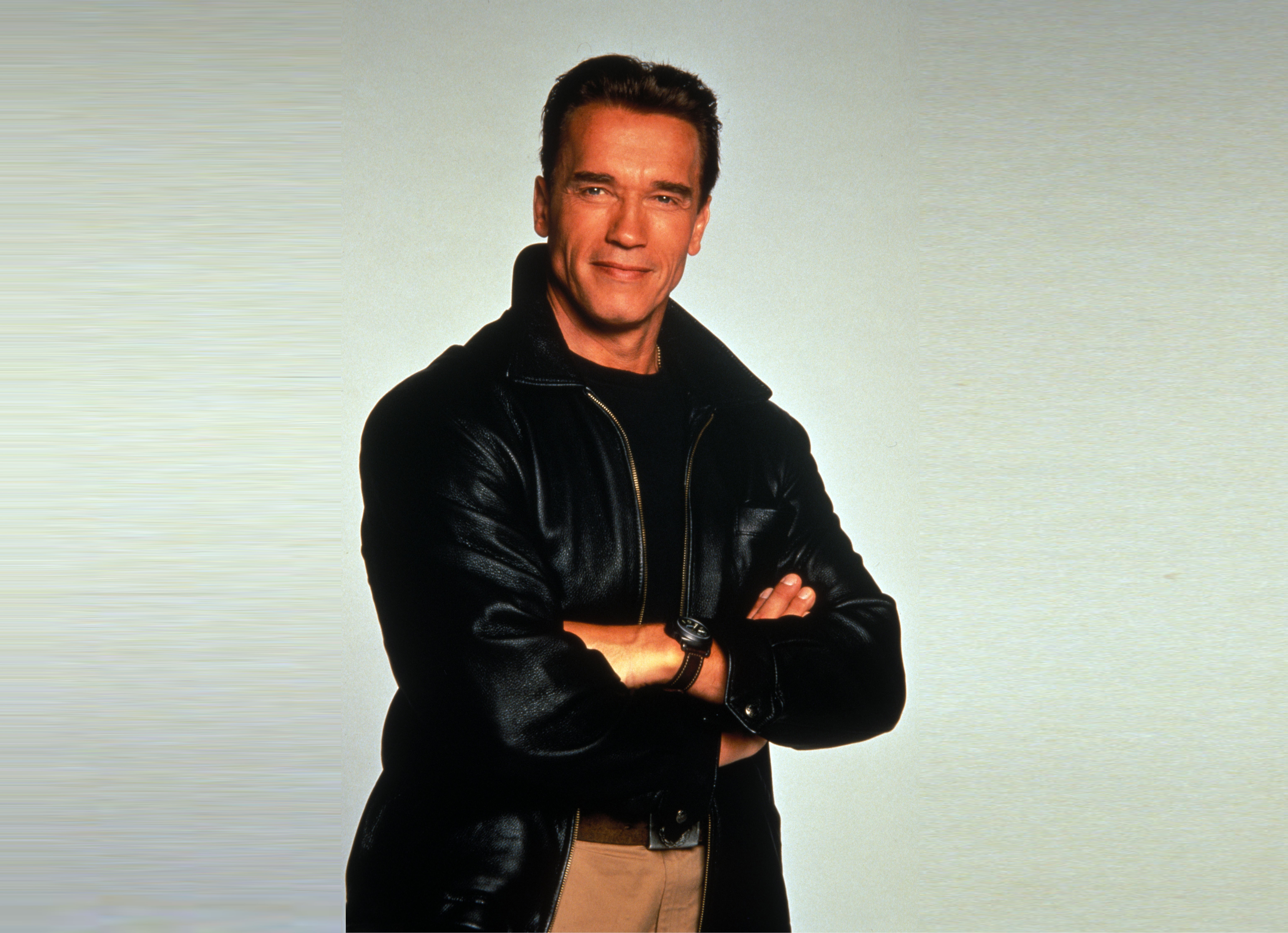 Arnold Schwarzenegger wearing a black jacket HD Wallpaper