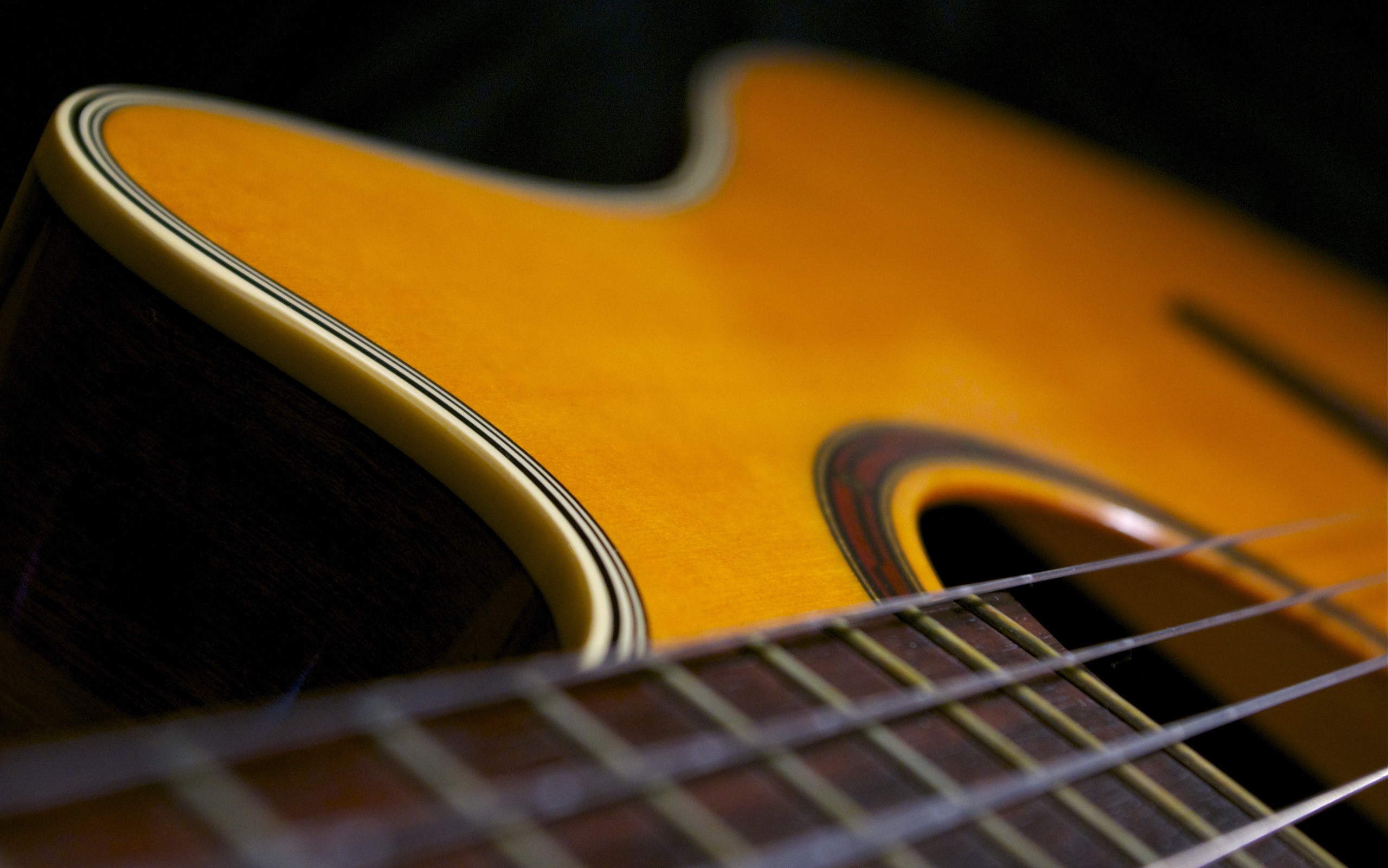 Closeup of an acoustic guitar HD Wallpaper