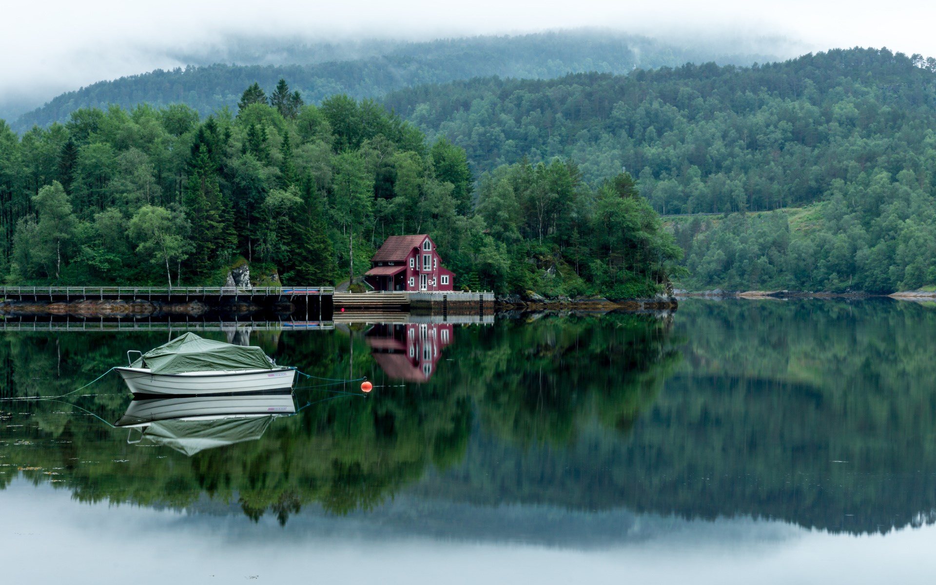 Red house by a lake with boats and forest HD Wallpaper