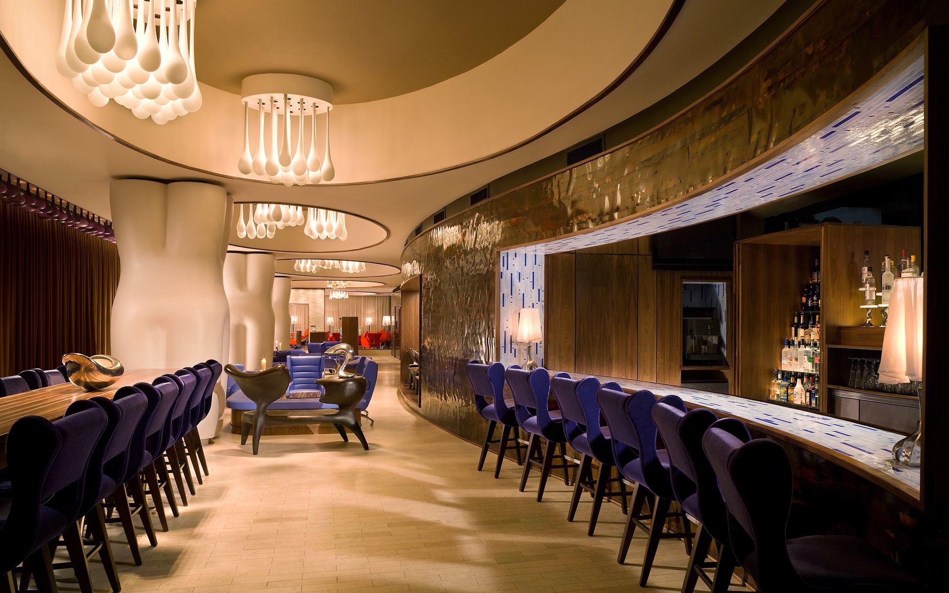 Modern Bar Interior with Purple Chairs and Sculptural Columns HD Wallpaper