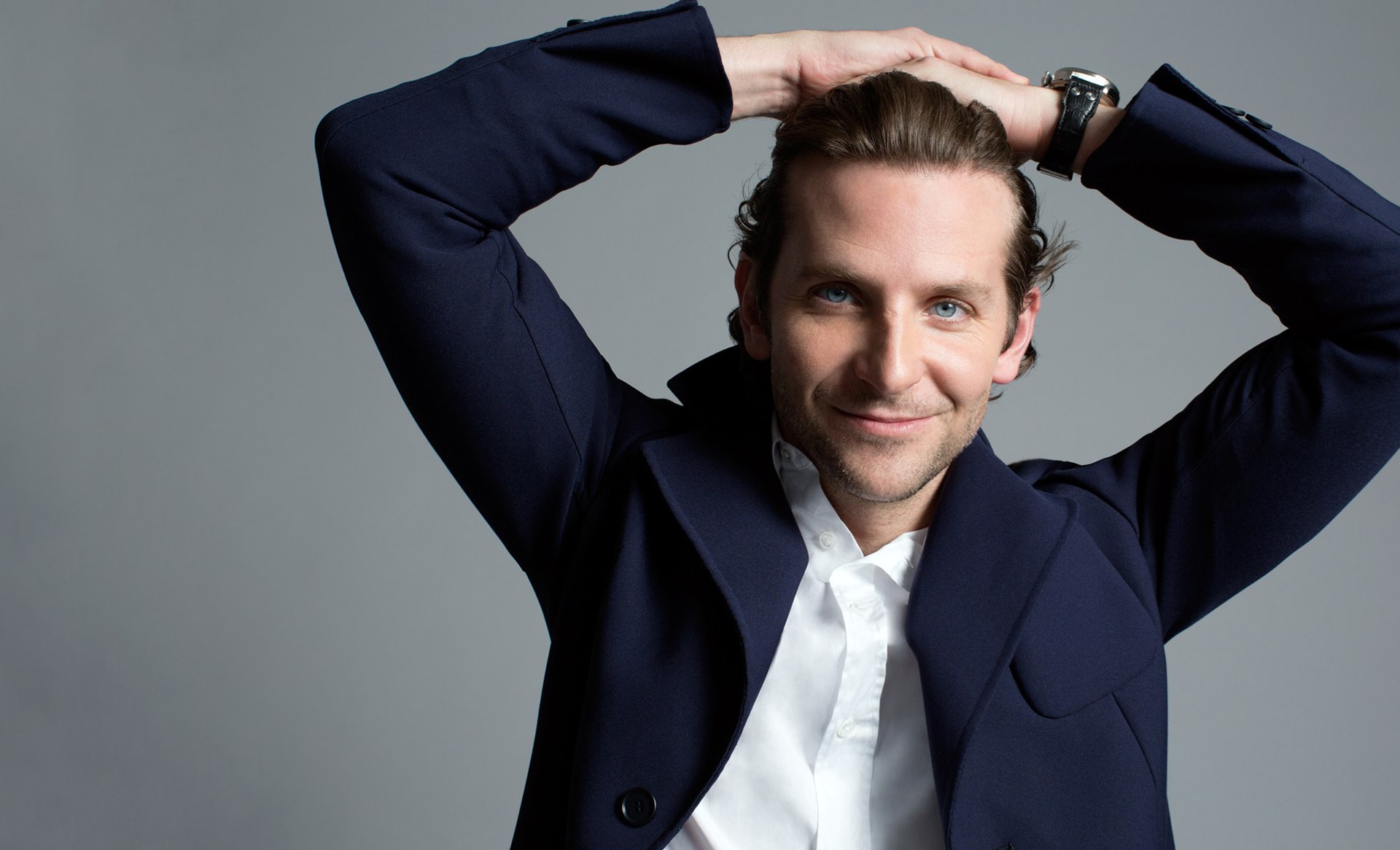 Bradley Cooper smiling with hands on head HD Wallpaper
