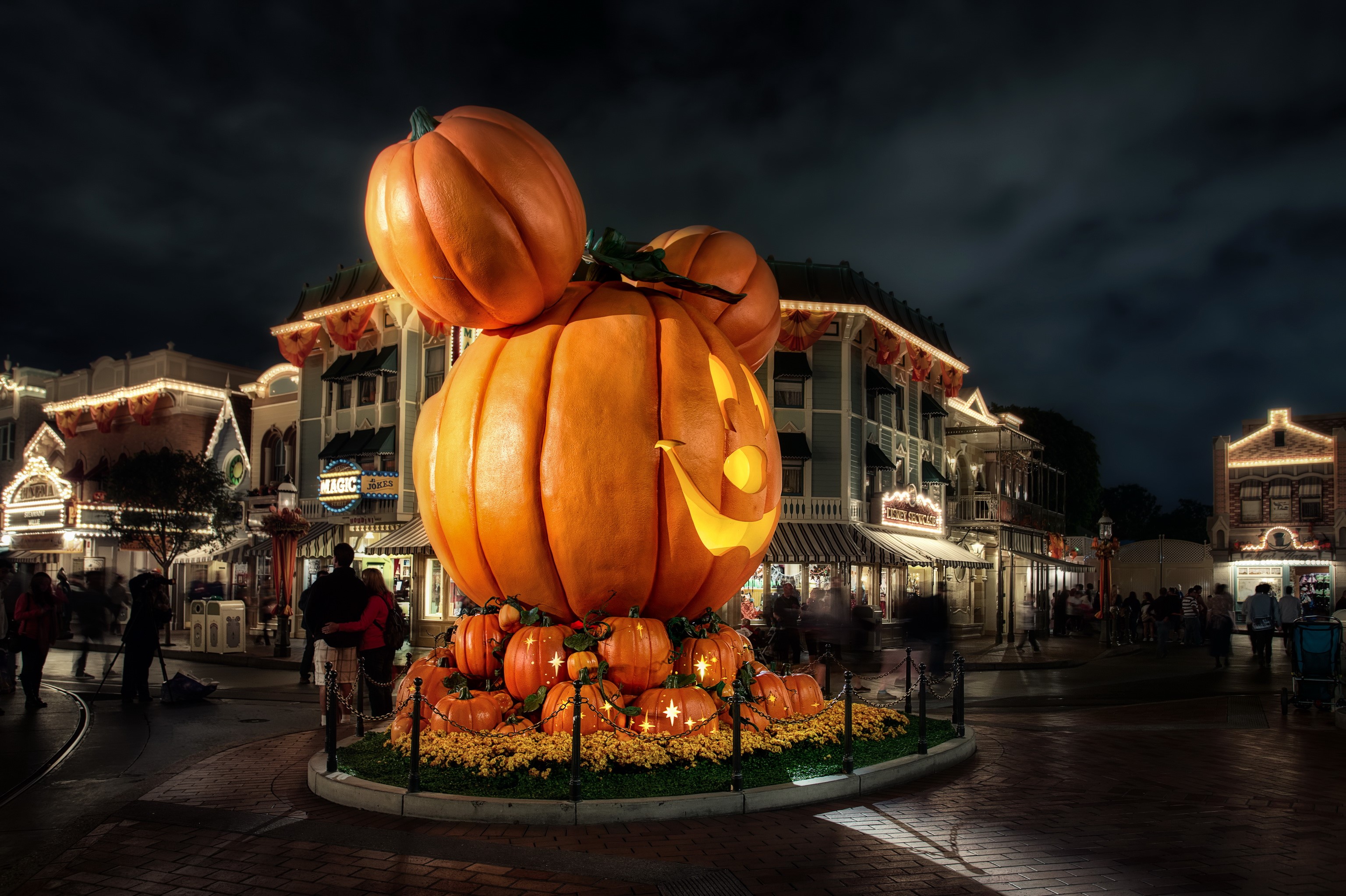 Mickey Mouse pumpkin decoration at Disneyland at night HD Wallpaper