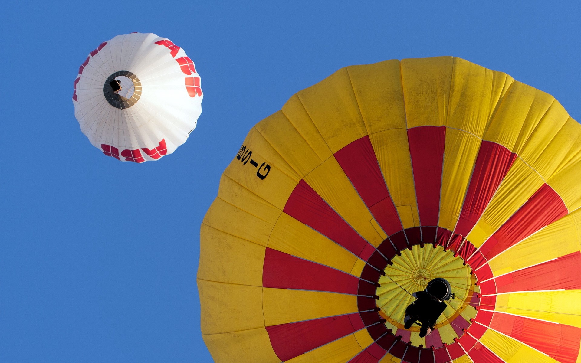 Two hot air balloons flying in the sky HD Wallpaper