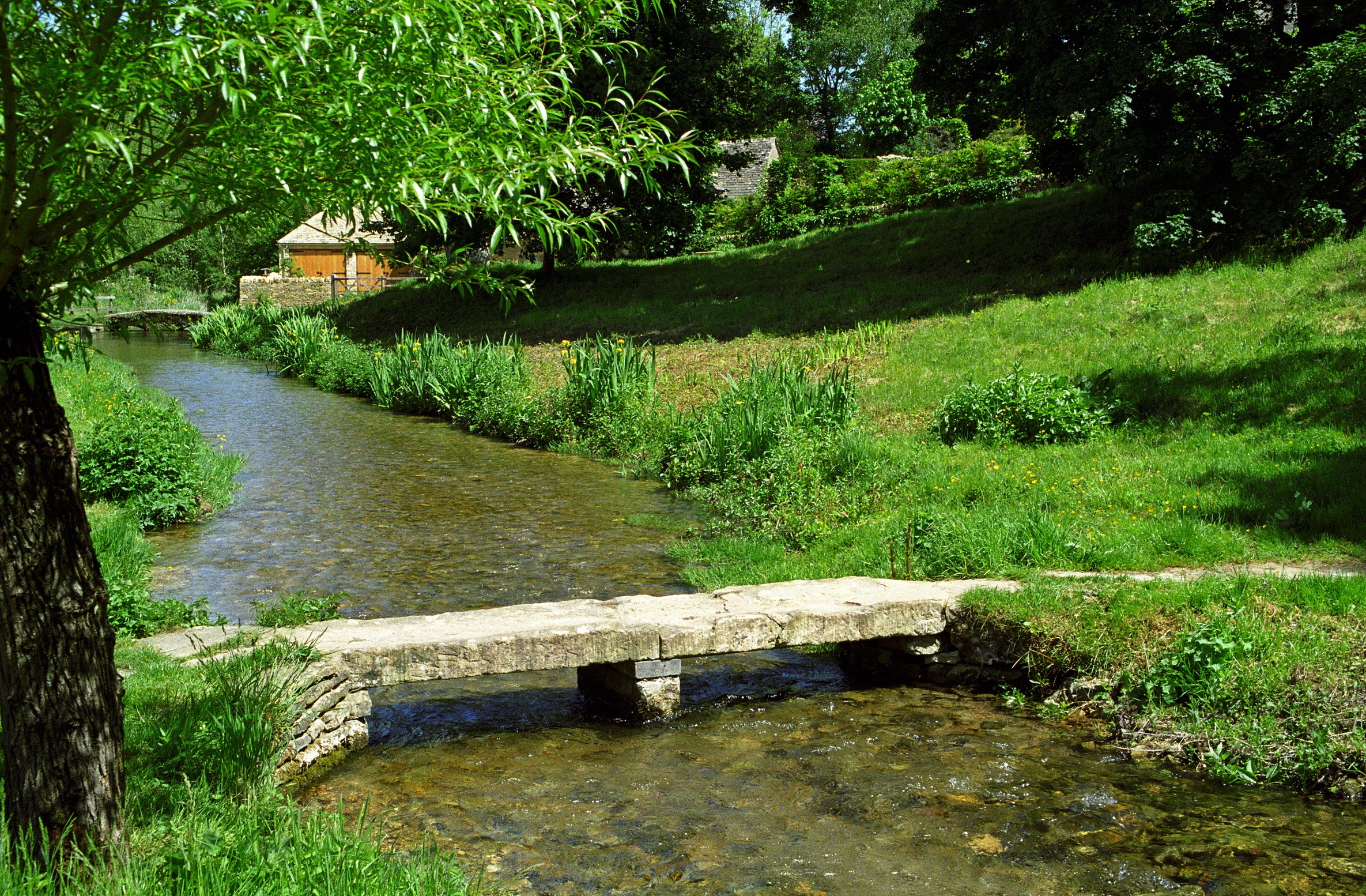Stone bridge over a stream in Upper Slaughter, Cotswolds, England HD Wallpaper