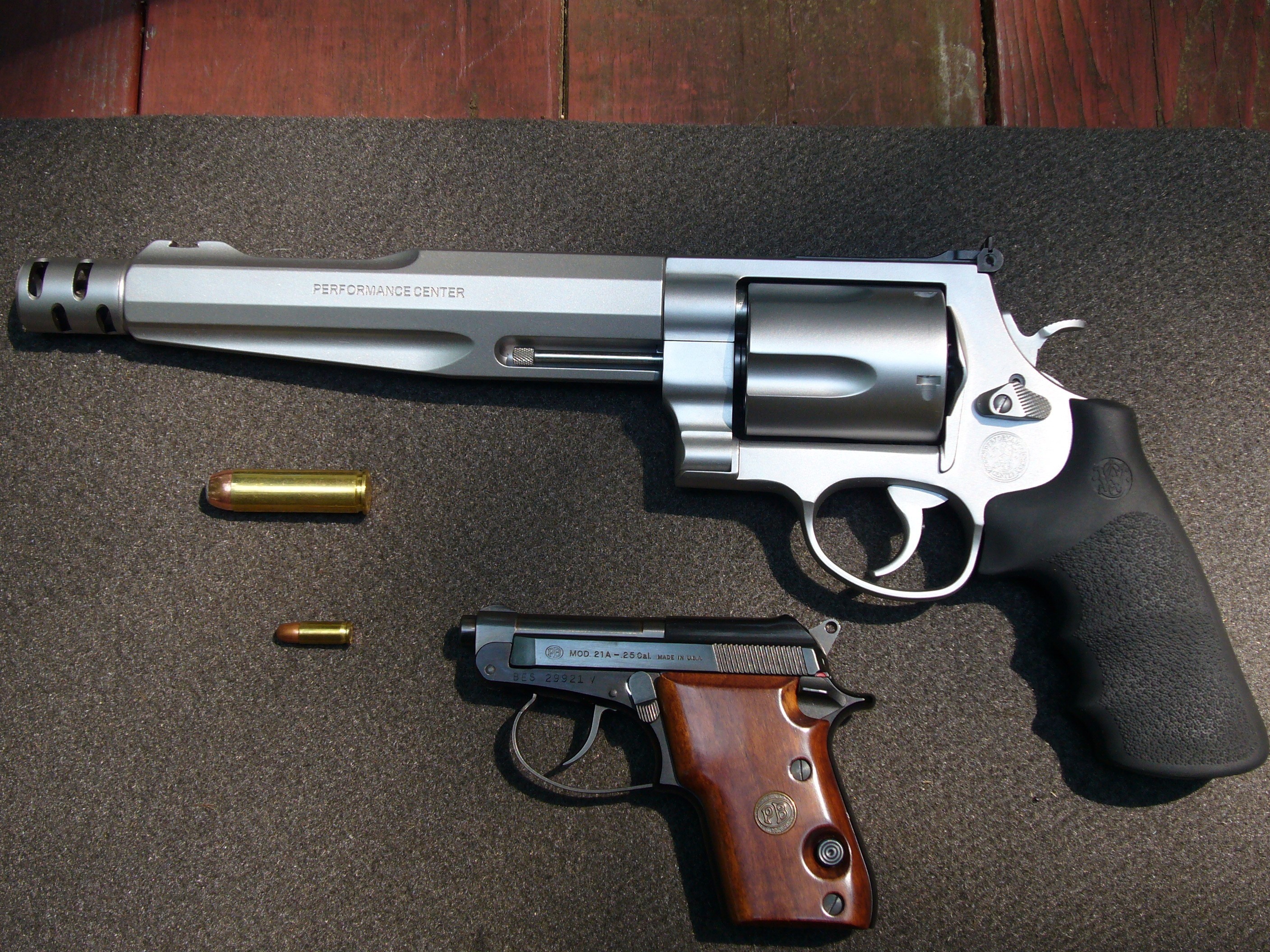 Smith & Wesson Revolver and Small Pistol with Ammunition HD Wallpaper