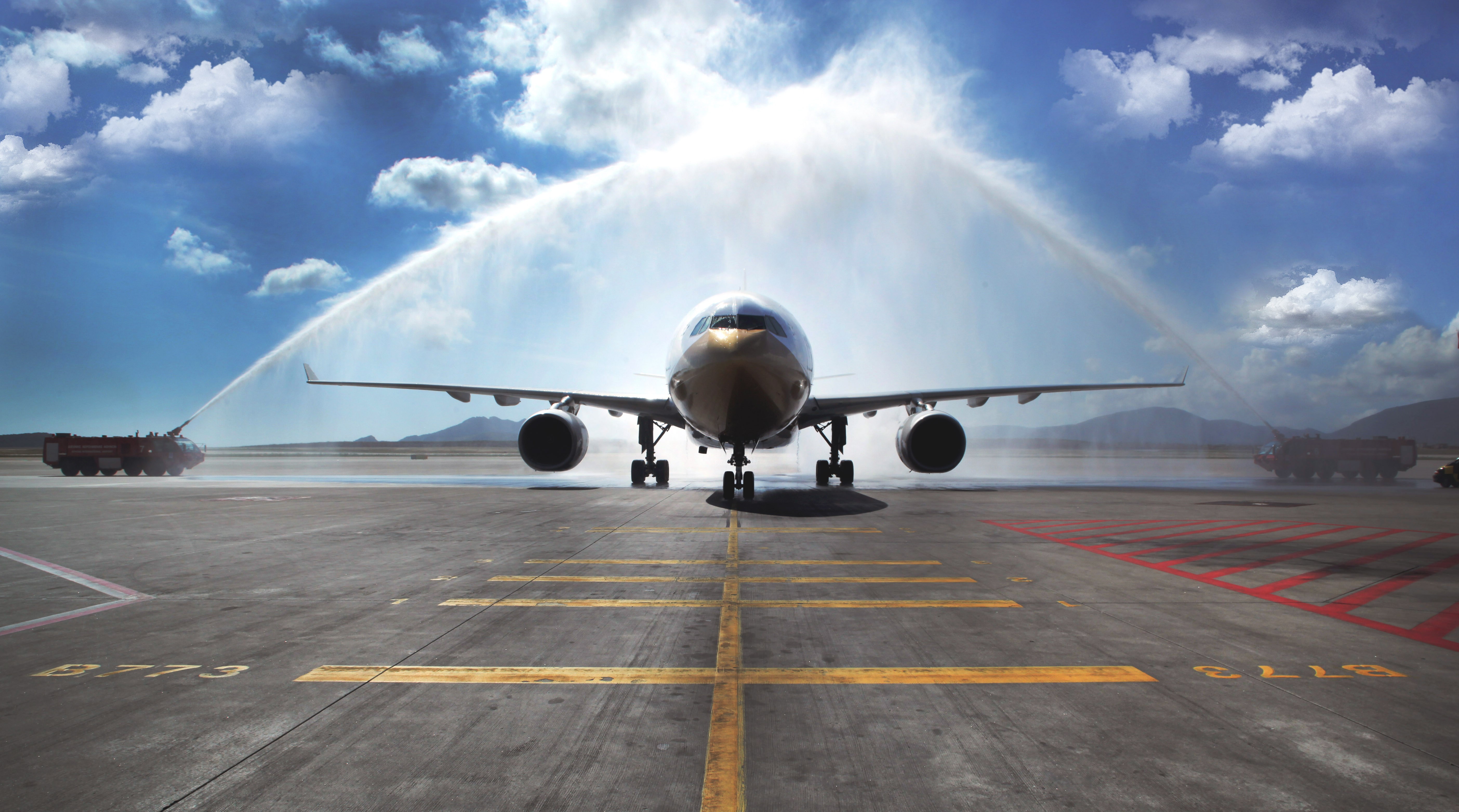 Airbus A330 receives water salute on tarmac HD Wallpaper