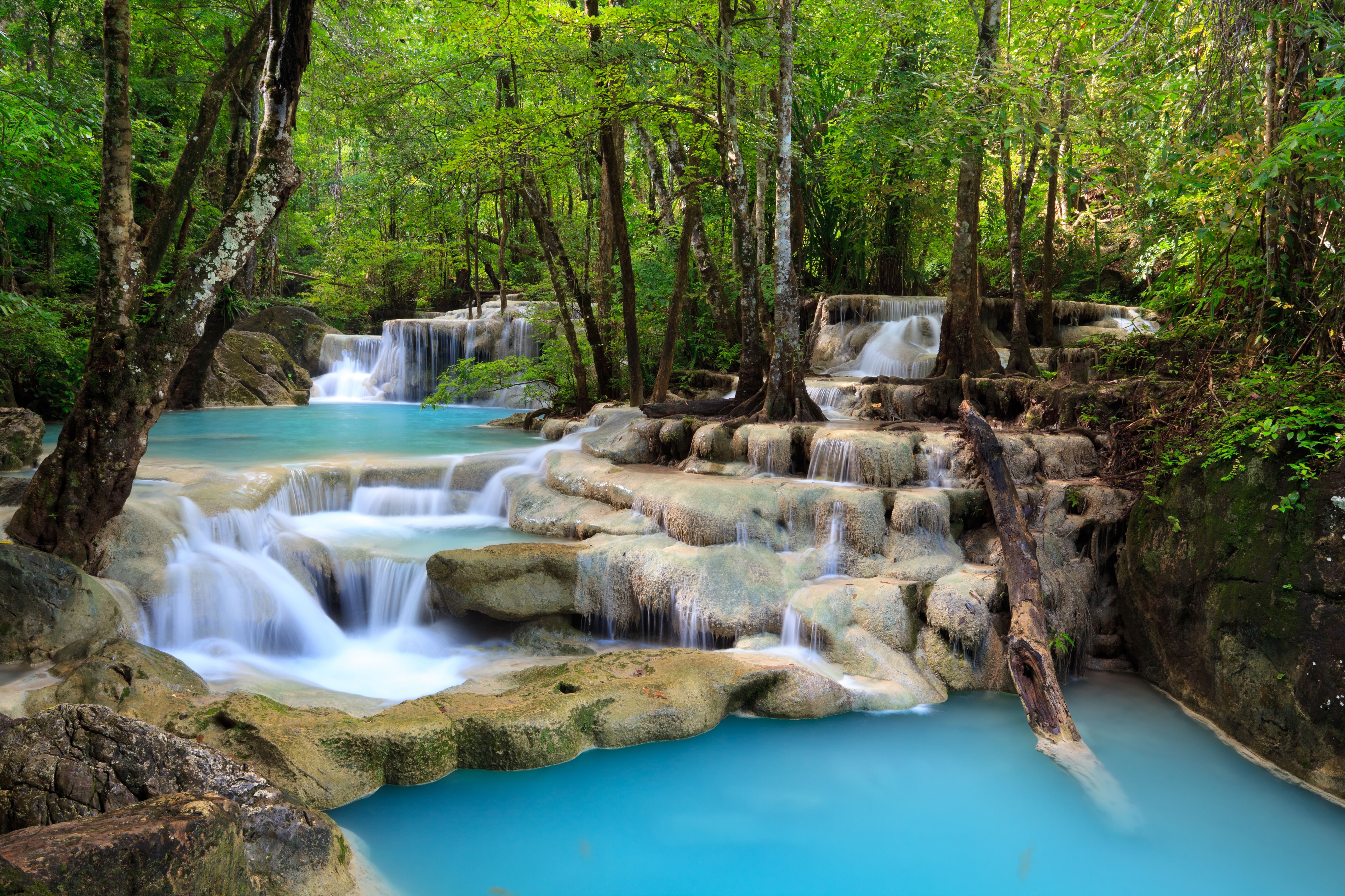 Waterfalls and stones in a forest in Thailand HD Wallpaper