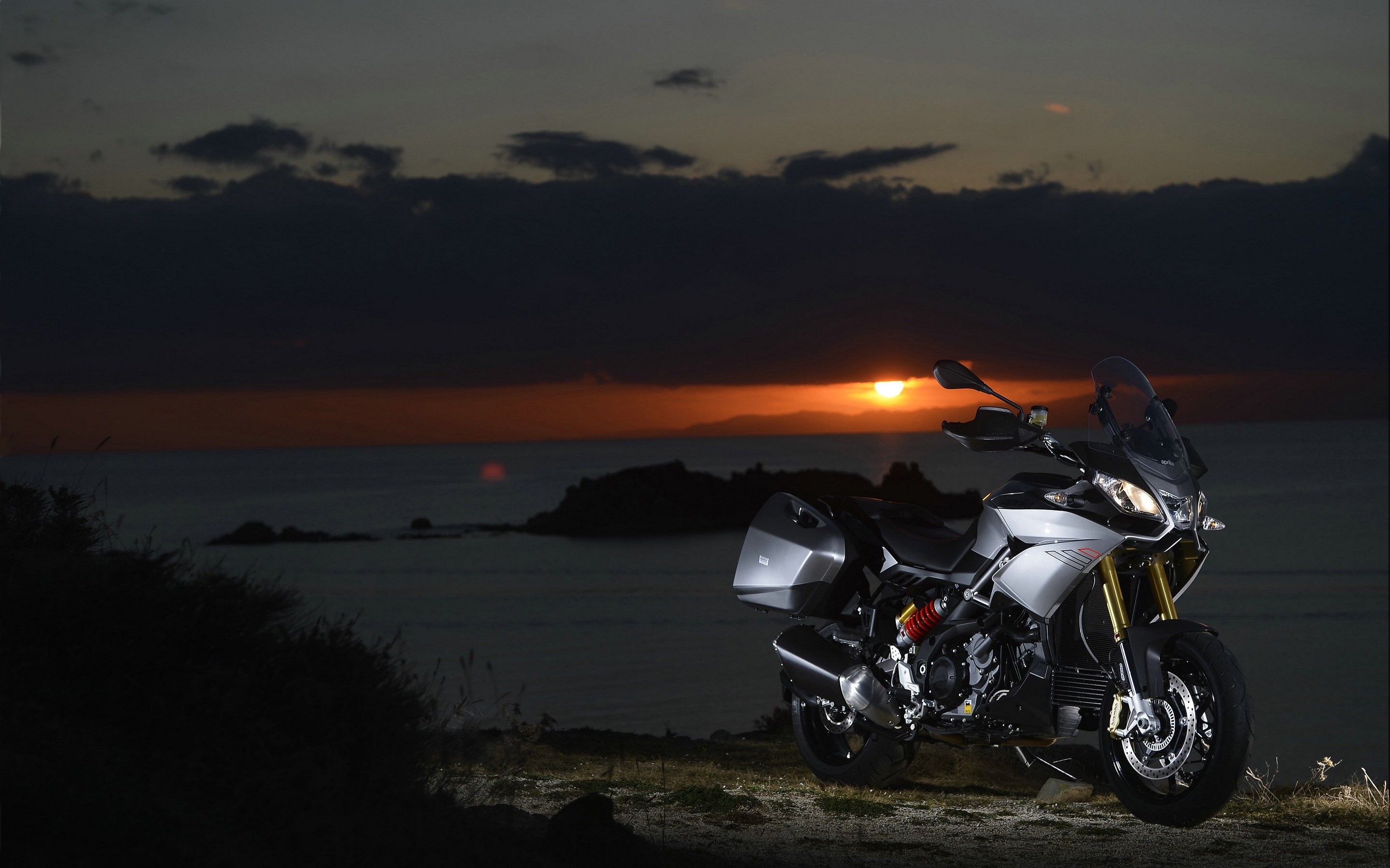 Aprilia Caponord 1200 motorcycle at sunset HD Wallpaper