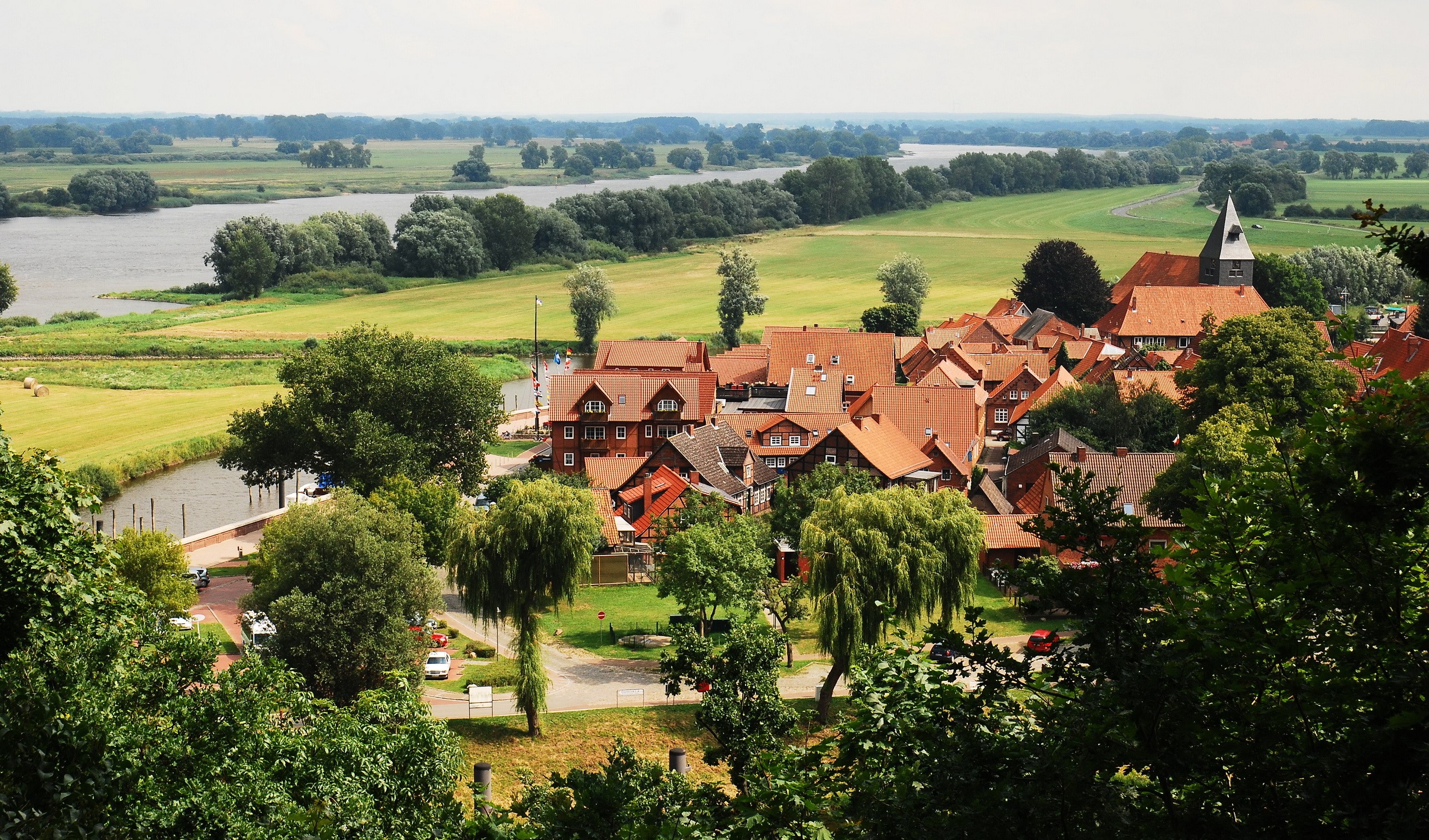 Hitzacker, Germany village with river and church HD Wallpaper