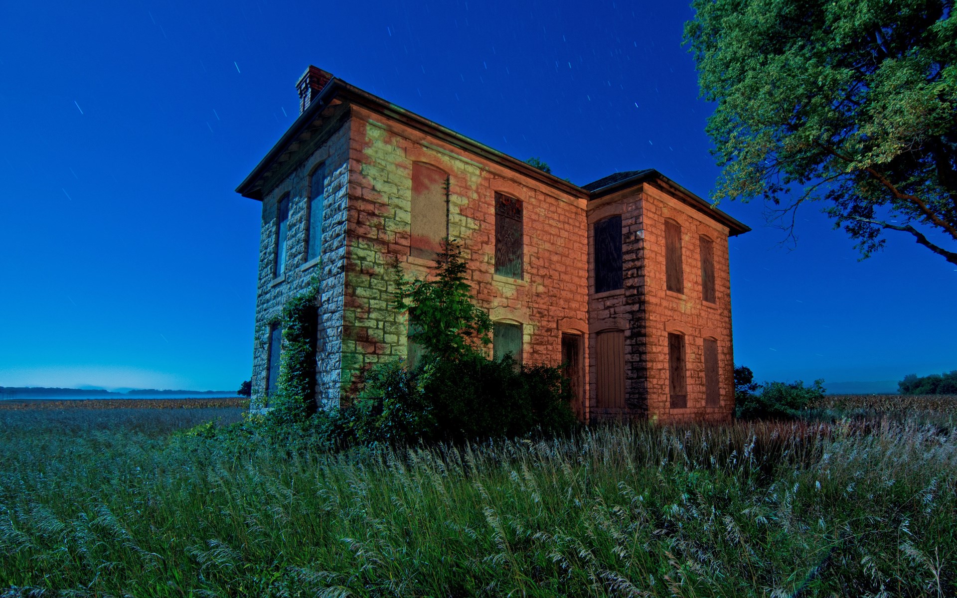 Abandoned stone house at night with starry sky HD Wallpaper