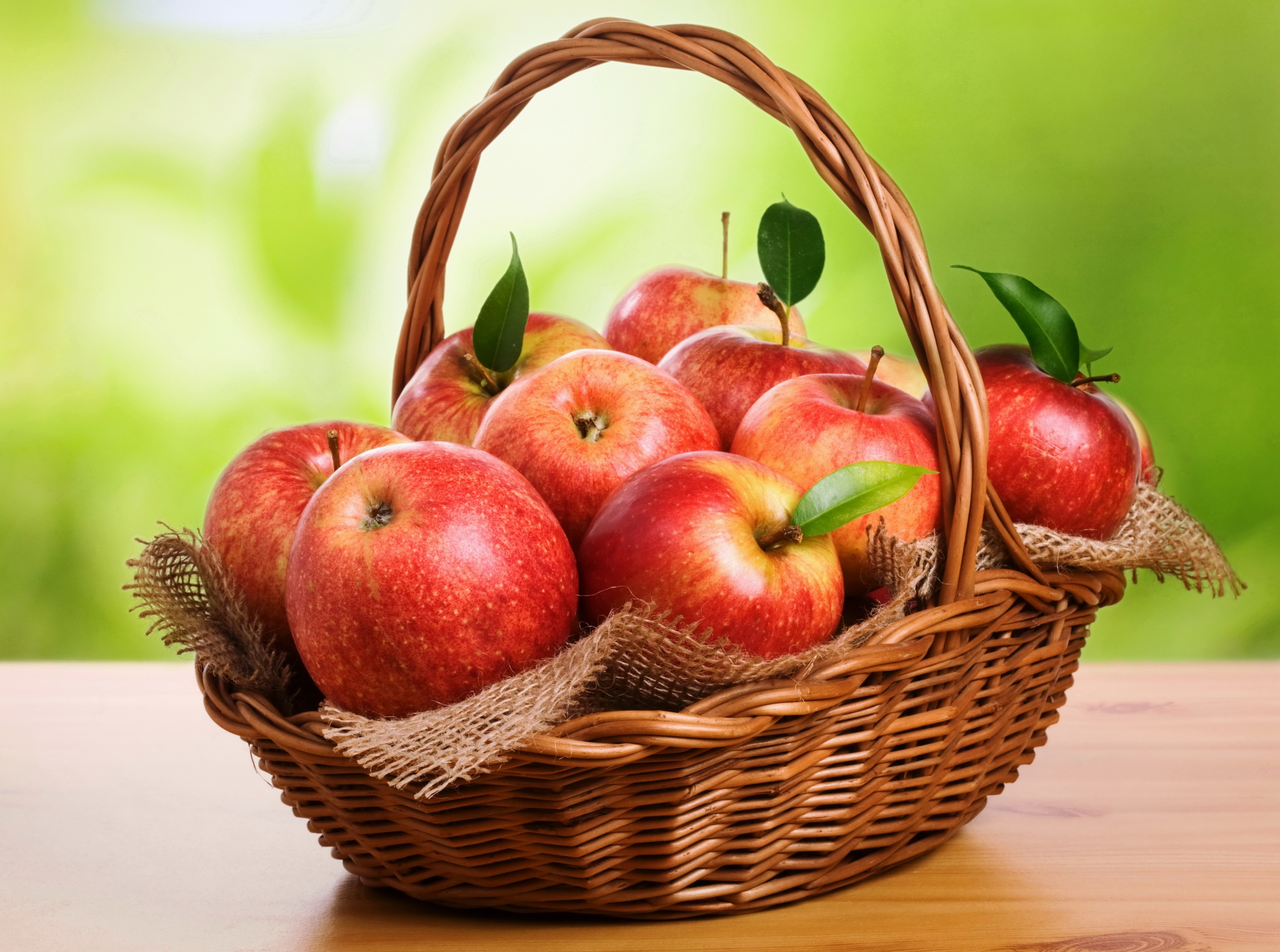 Basket of Red Apples with Green Background HD Wallpaper