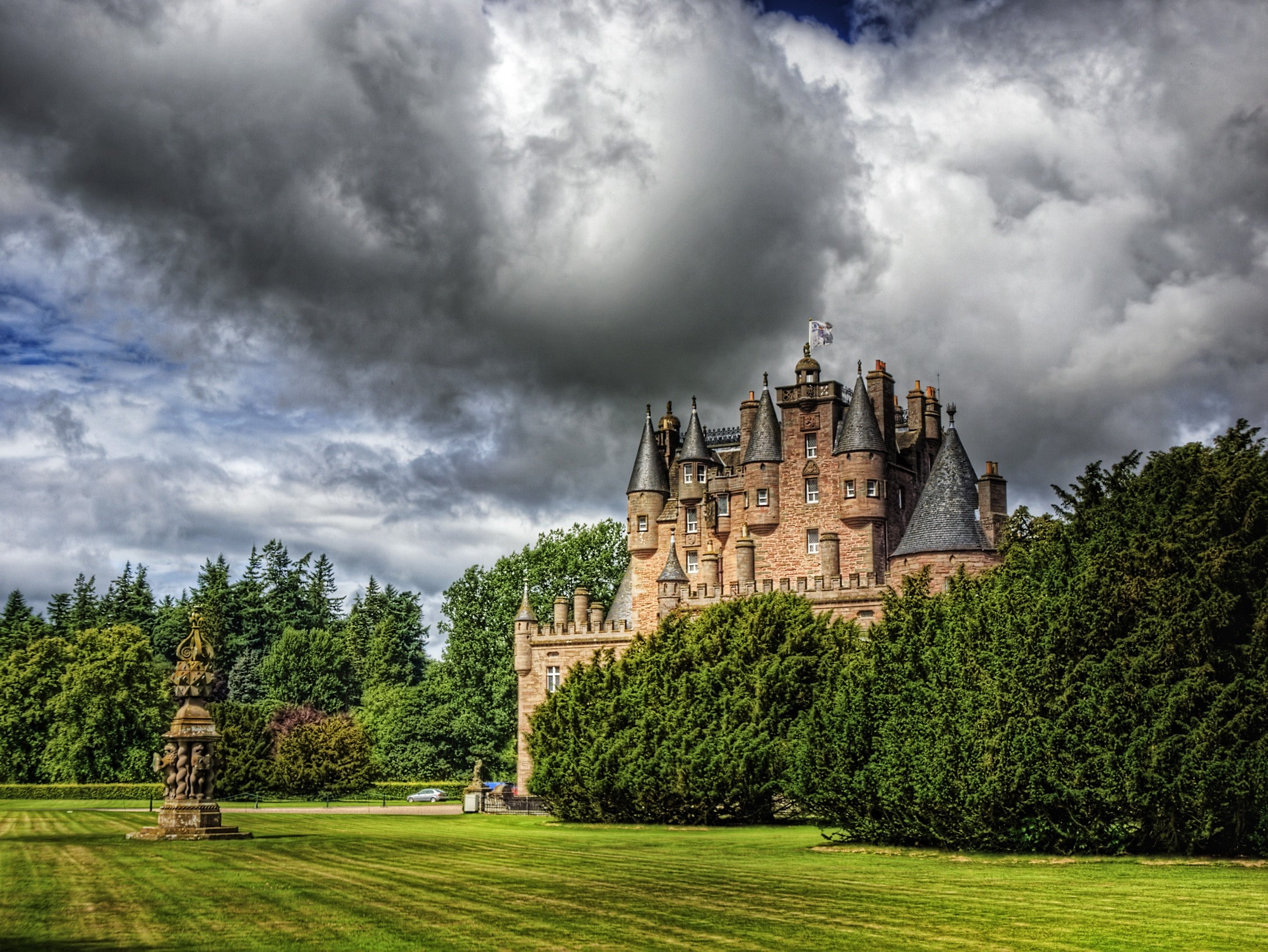 Glamis Castle in Scotland with dramatic clouds HD Wallpaper