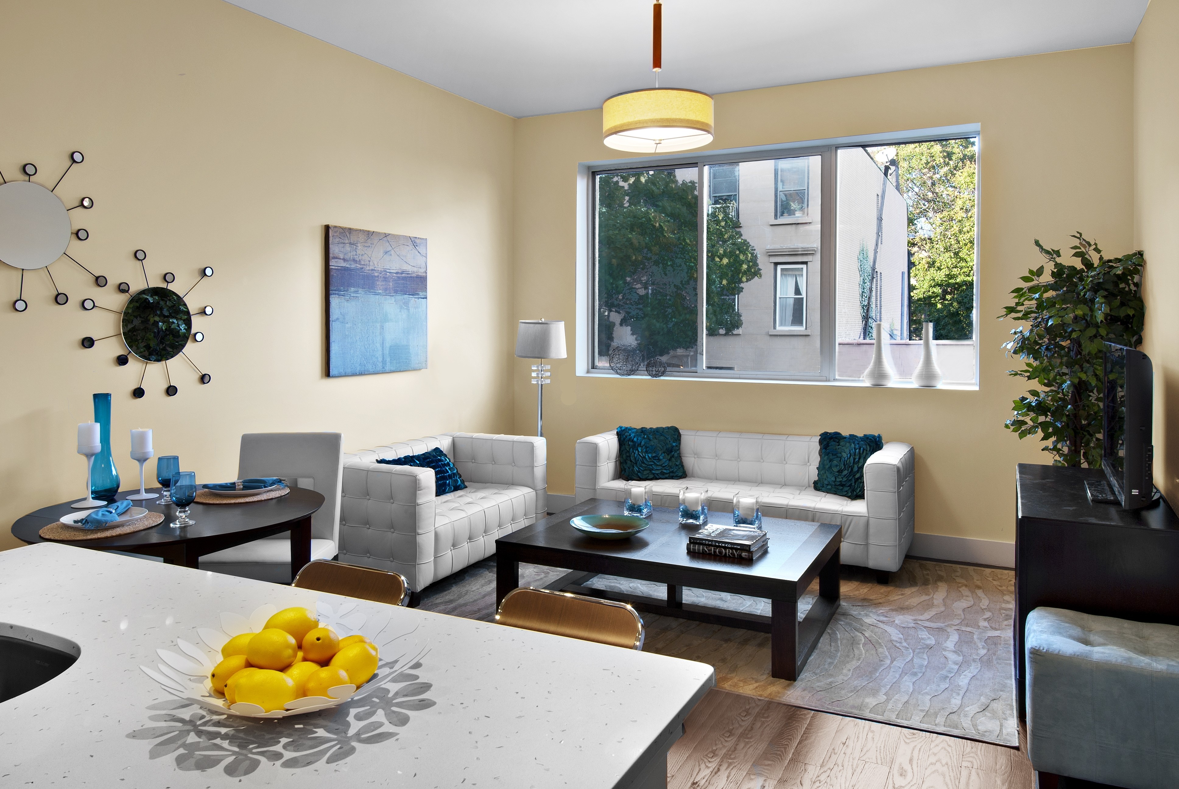 Living room with sofas, table, and lemons HD Wallpaper