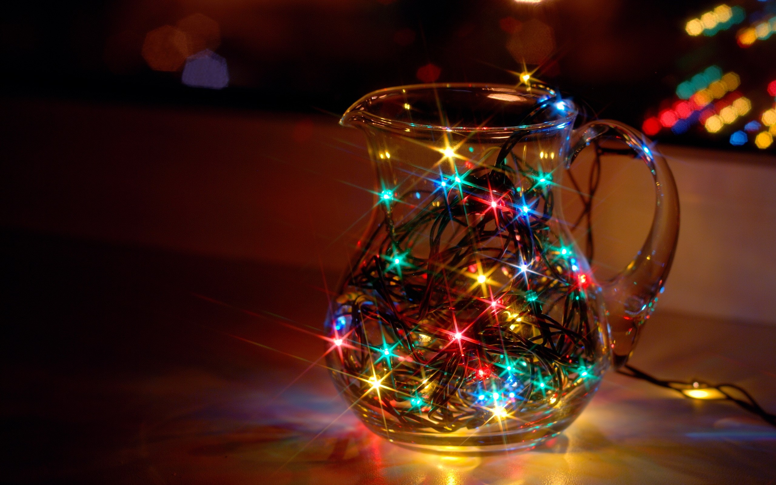 Glass jug filled with colorful Christmas fairy lights HD Wallpaper