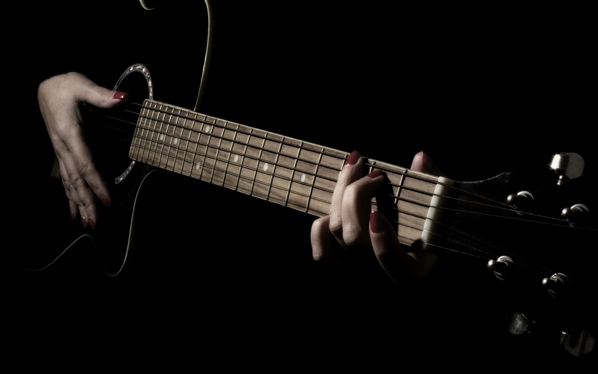 Close-up of hands playing a guitar HD Wallpaper