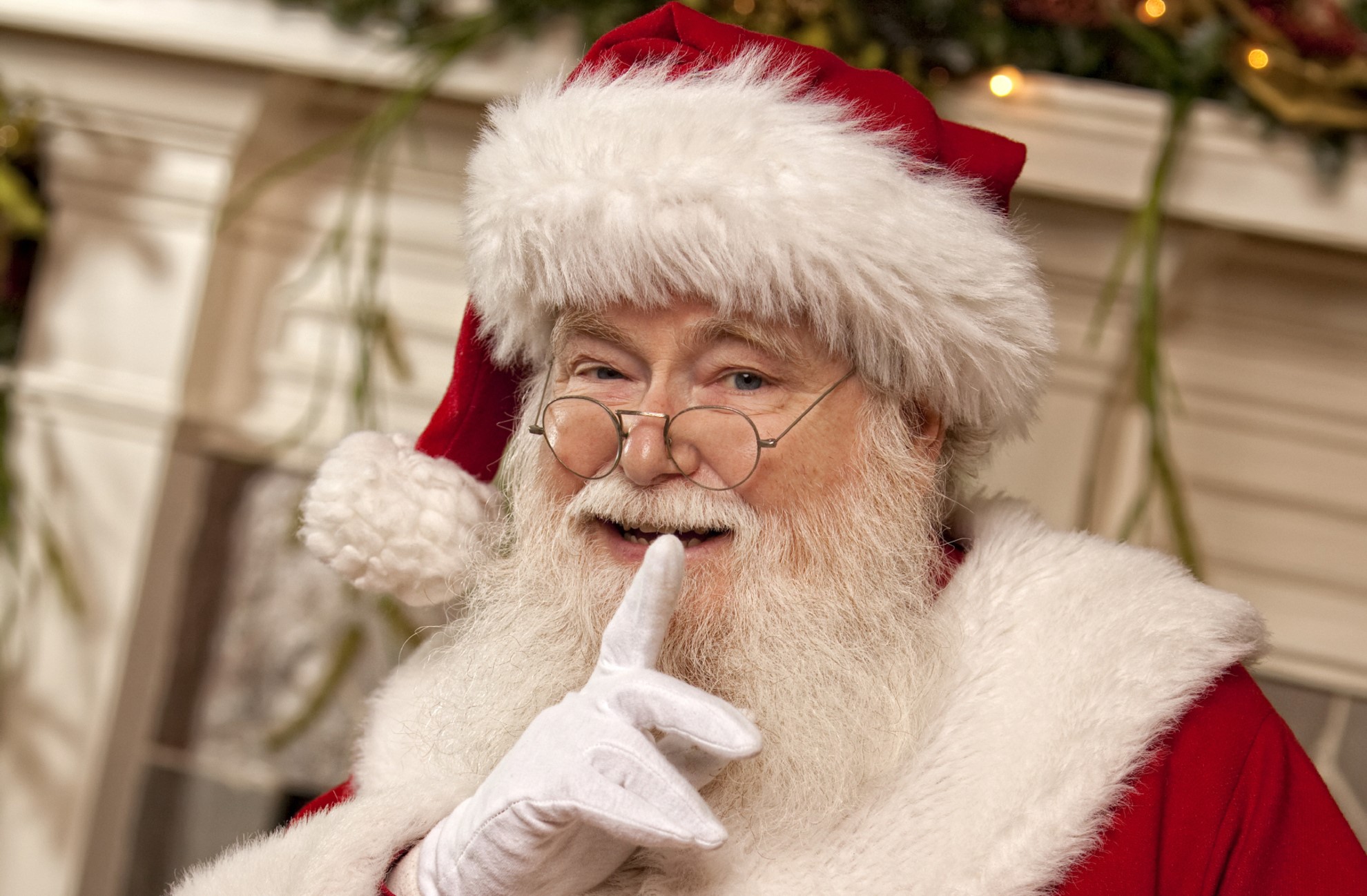 Santa Claus winking and holding a finger to his lips HD Wallpaper