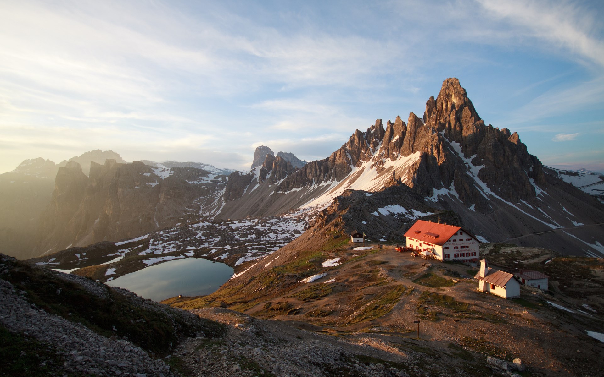 Mountain landscape with lake and buildings HD Wallpaper