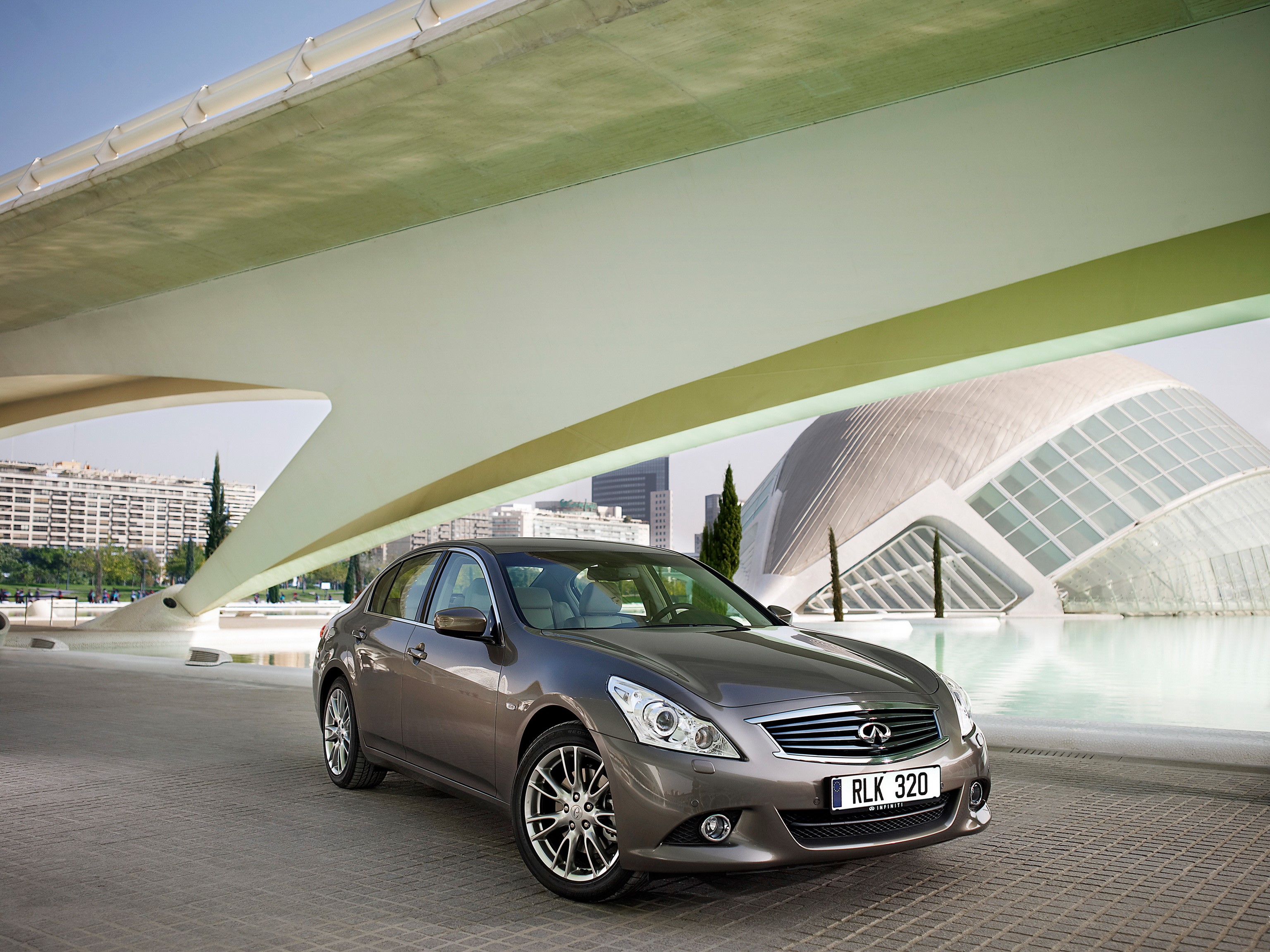 Infiniti G37 Sedan parked under a modern bridge HD Wallpaper
